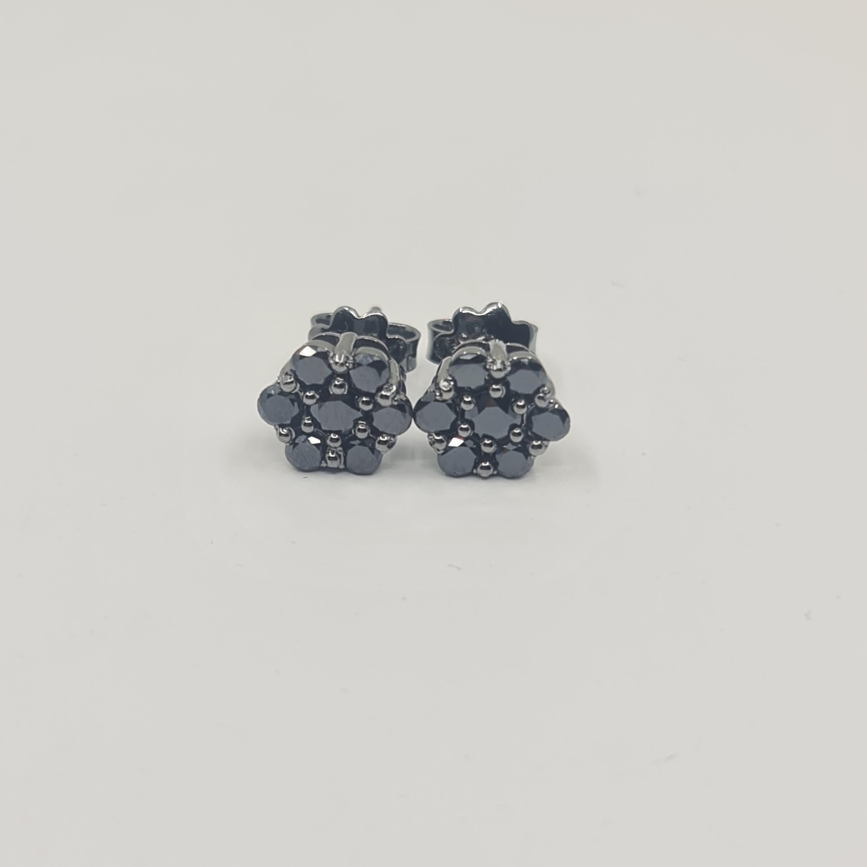 Exquisite Black Diamond Earrings 1.11 Carat in 18K Black Gold Round Cut

Black is Beautiful. Black is Powerful.
We are very excited to introduce our brand new BLACK STARS collection worldwide! 
All Black Diamonds set in Black Coated 18K Gold. 
Pure