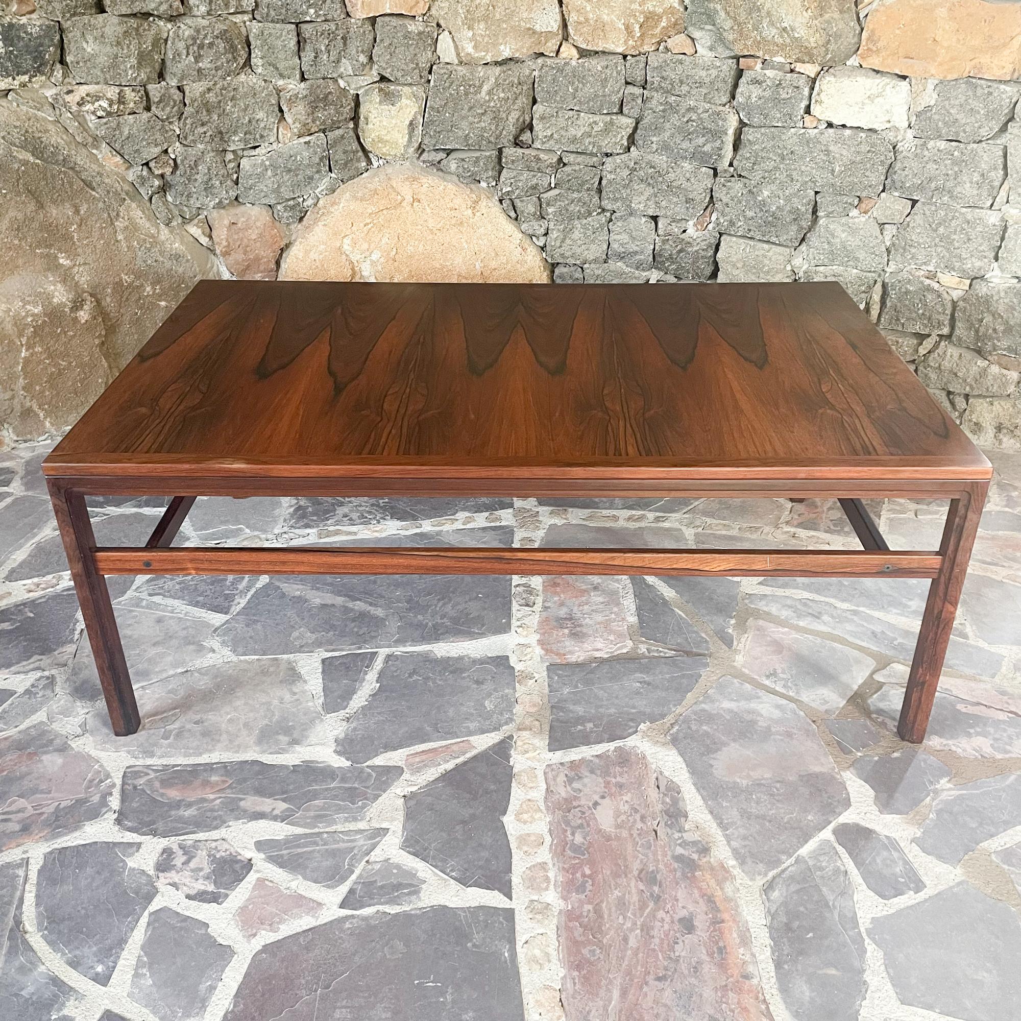 Exquisite Brazilian Rosewood Coffee Table Modern 1970s
19.75 h x 51.13 w x 31.63 inches
Legs can be removed, allowing for easy transport.
Unmarked, Ghost sticker underneath.
Preowned original vintage condition.
Review images.
Delivery to LA OC Palm