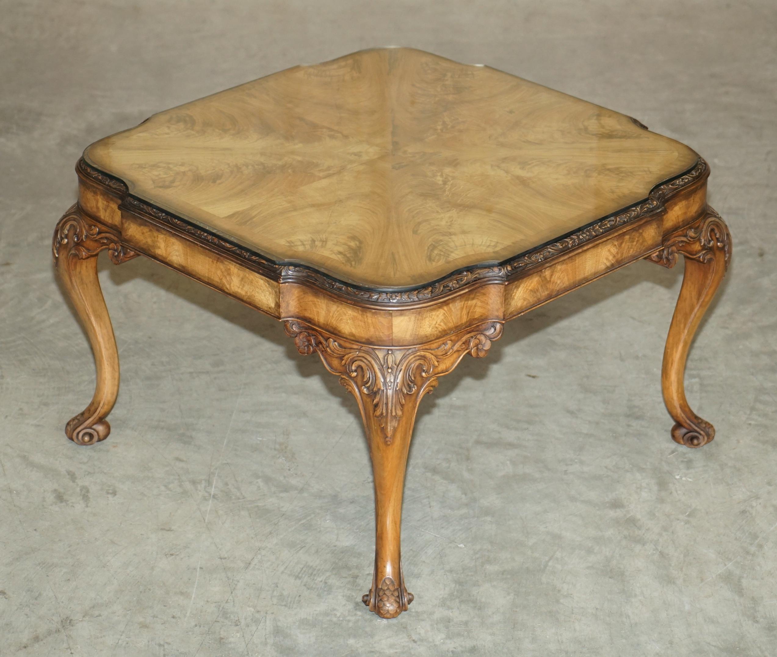 We are delighted to offer for sale this stunning hand made in England, quarter cut and burr walnut coffee table with stunning carvings 

A good looking, well made and decorative coffee table with some of the nicest carvings I have ever seen on