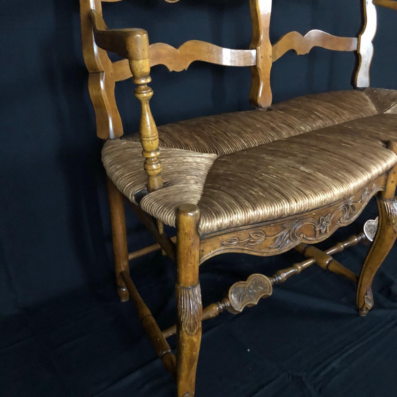 Exquisite Carved 19th Century French Walnut Ladderback Bench with Rush Seat 1