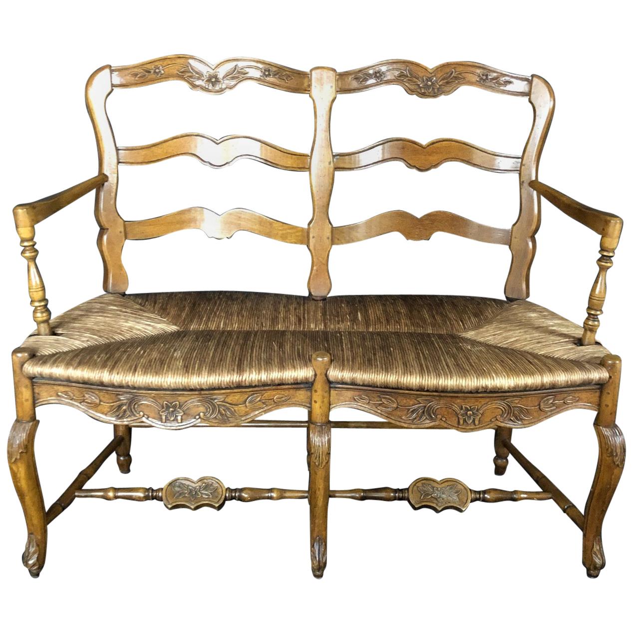 Exquisite Carved 19th Century French Walnut Ladderback Bench with Rush Seat