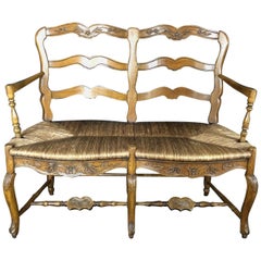 Exquisite Carved 19th Century French Walnut Ladderback Bench with Rush Seat