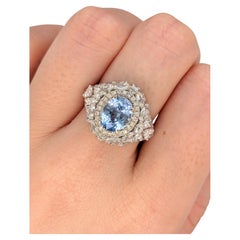 Magnifique bague complexe en or bicolore 18 carats avec saphir bleu de Ceylan