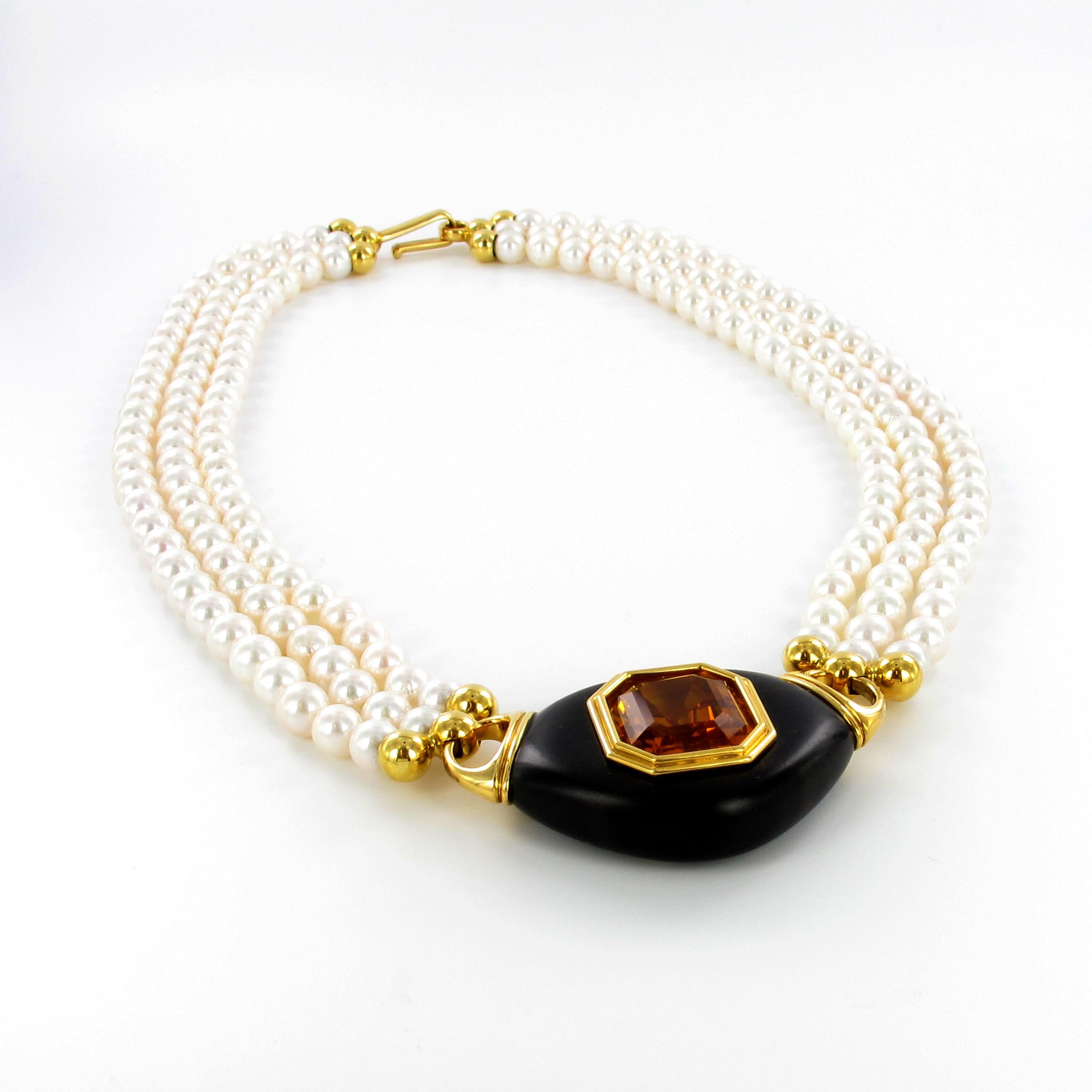 This exquisite and bold necklace features a 15.70 carats octagonal shaped citrine, bezel set in 18 karat yellow gold and placed into smoothly polished ebony. Attached to a three-strand necklace consisting of 172 round Akoya cultured pearls from 6.0