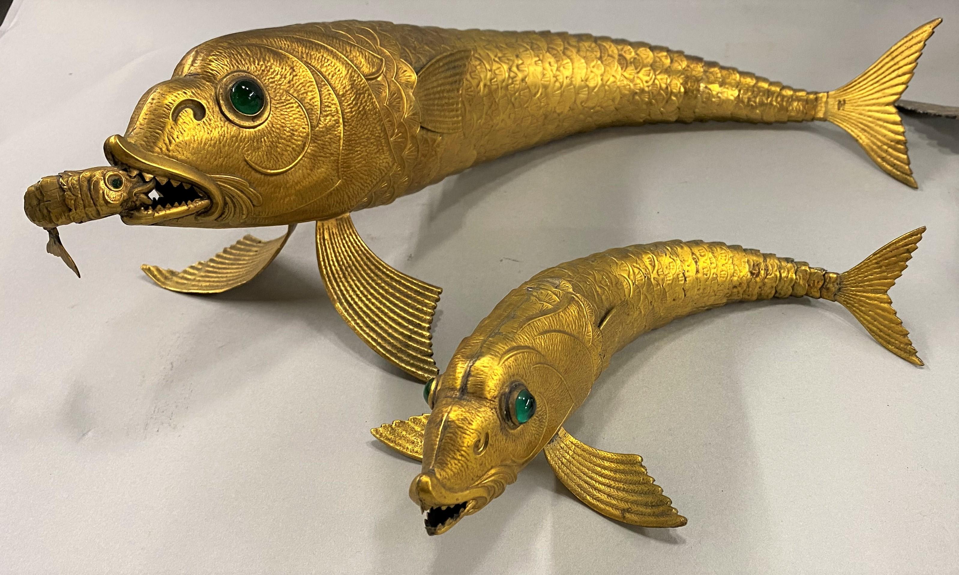 A wonderful collection of articulated silver fish, including two gilt fish stamped “Made in Spain,” and four silver fish, one marked “Sterling 925, Italy” with faint hallmark, another marked VEGA 18 with other illegible hallmarks, and two others