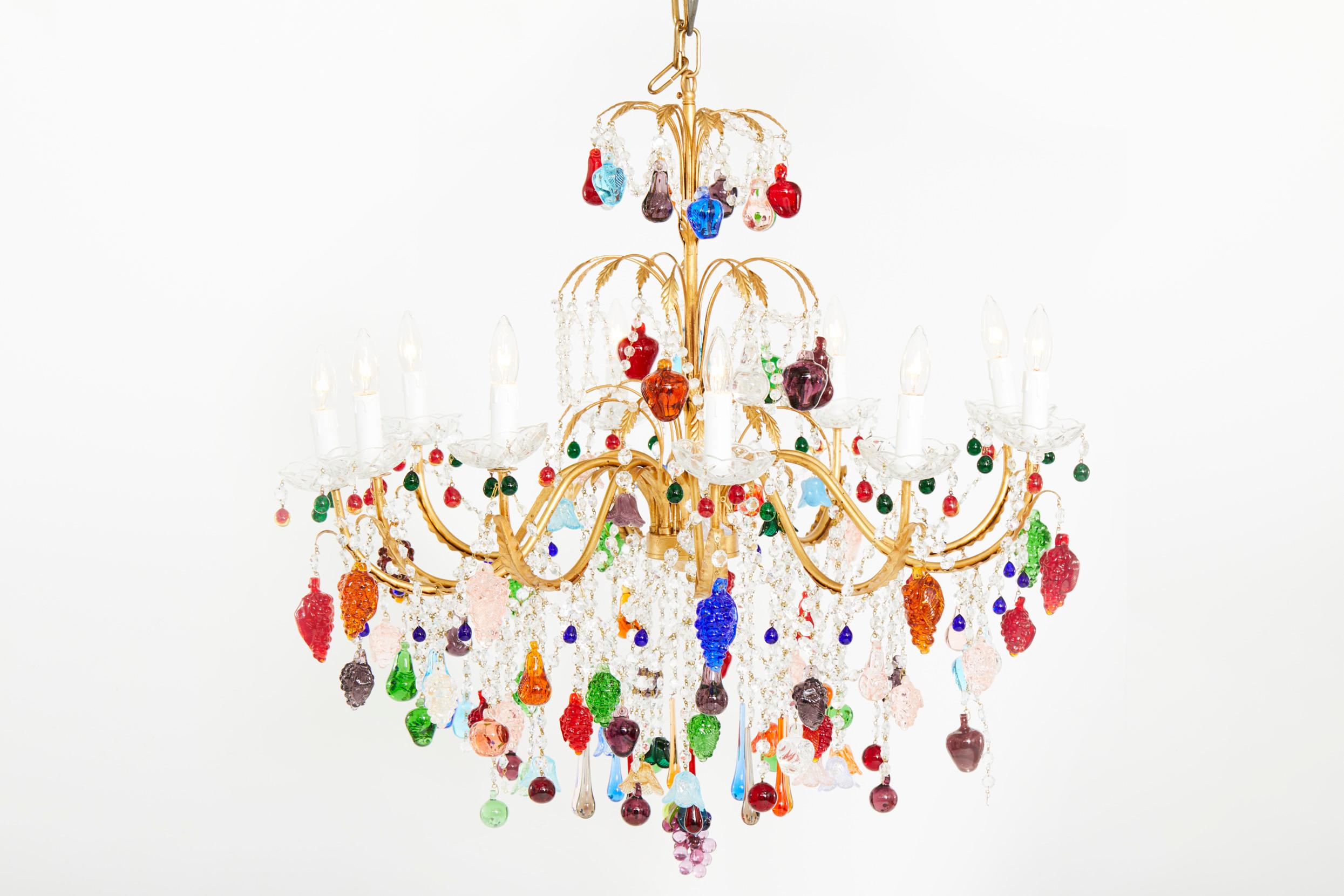 Exquisite colored crystal fruits design details with gilt brass frame ten lights hanging chandelier.
The chandelier is in great working condition. Minor wear consistent with age / use. Rewired for US use. No special light bulbs required. The