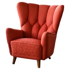 Exquis fauteuil de salon danois du milieu du siècle dernier en laine rouge de style Lassen, années 1940