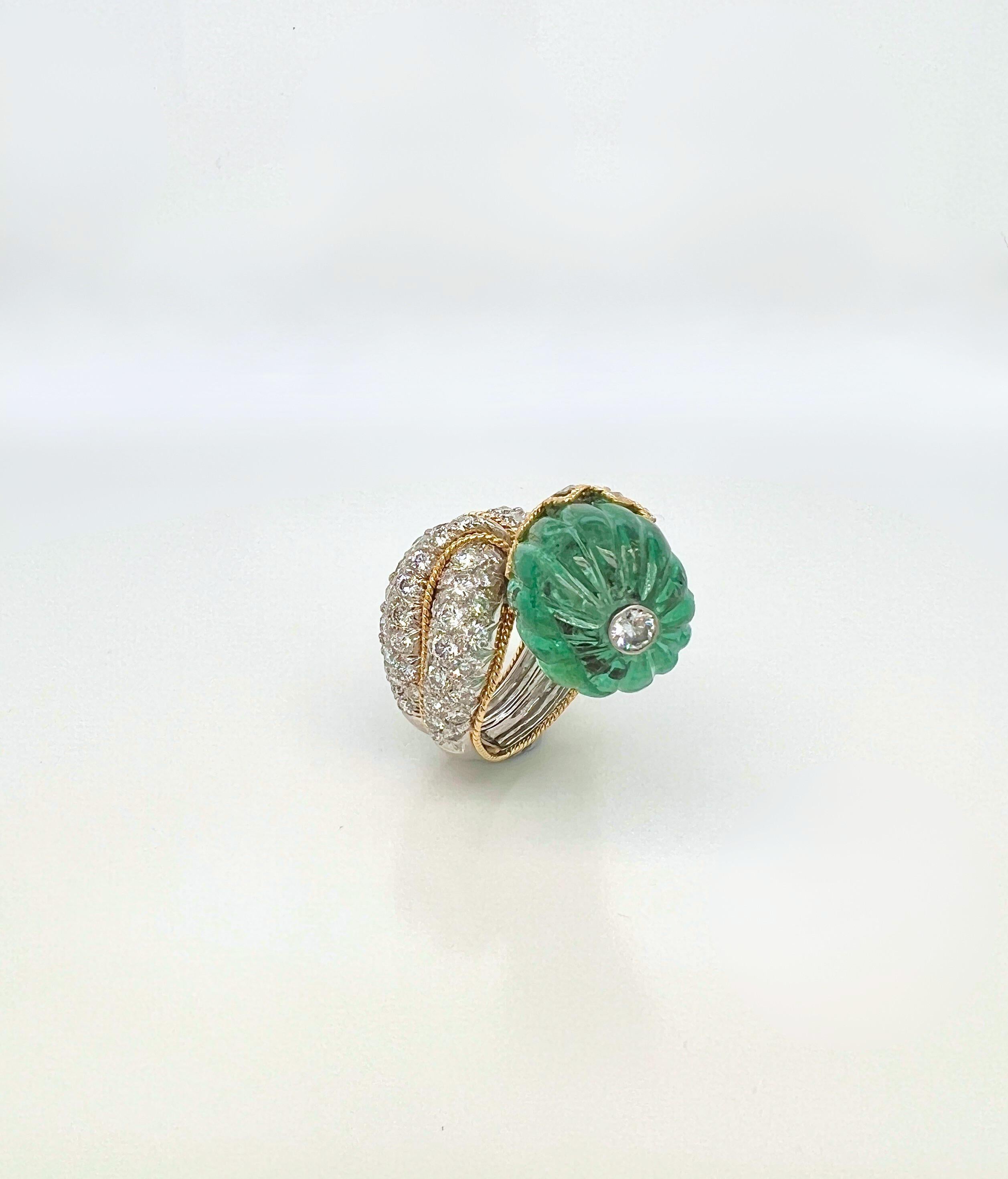 Exquisite David Webb Emerald and Diamond Gold Platinum Ring

Details:
Approx. 25-28 carats of emerald, Ring size 5 and a half, Weight 23.1 grams. 
Hallmarked: 
