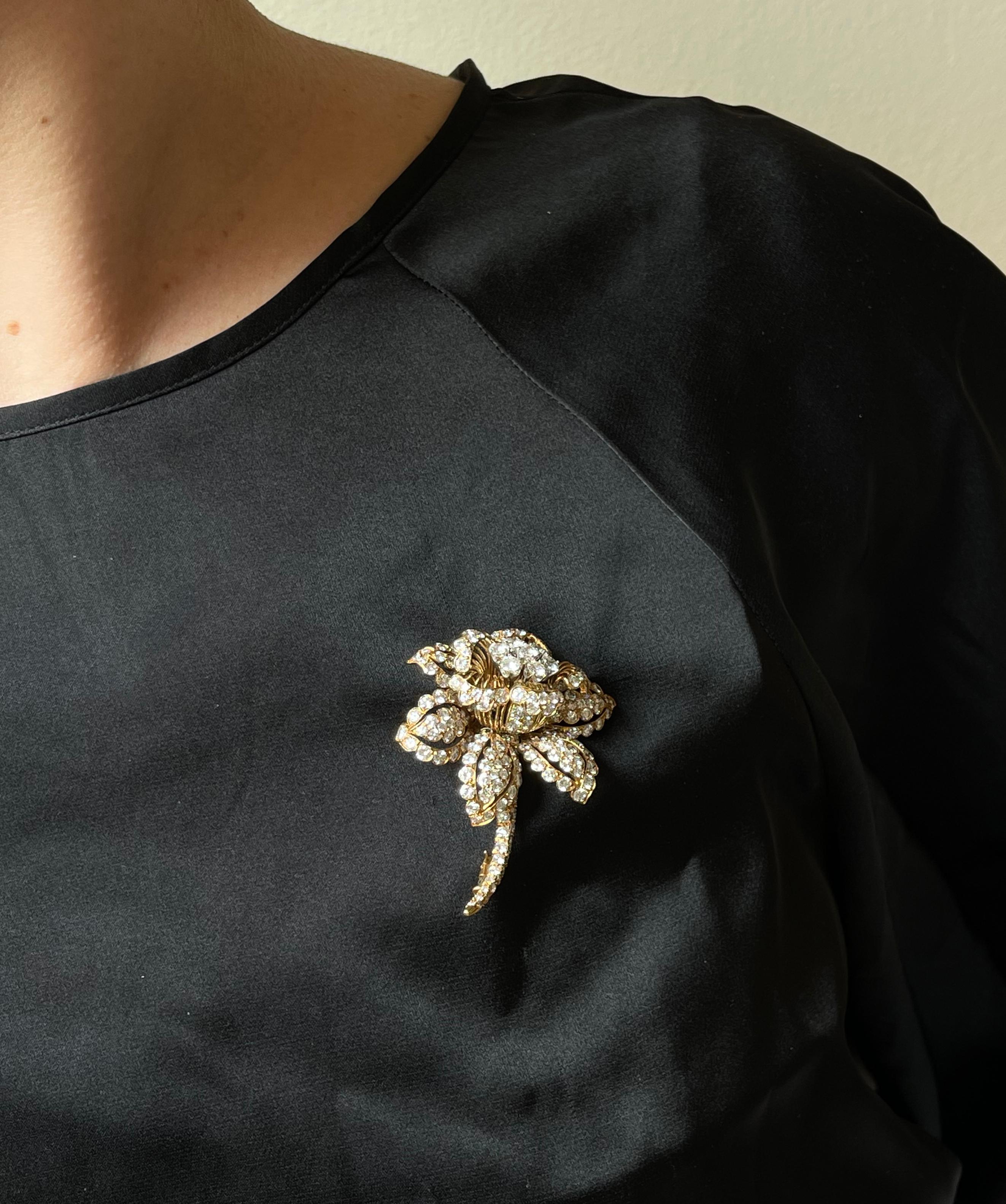 Beautiful 18k gold flower brooch by David Webb, set with approx. 9 carat H/VS-Si diamonds. Brooch measures 2 3/8
