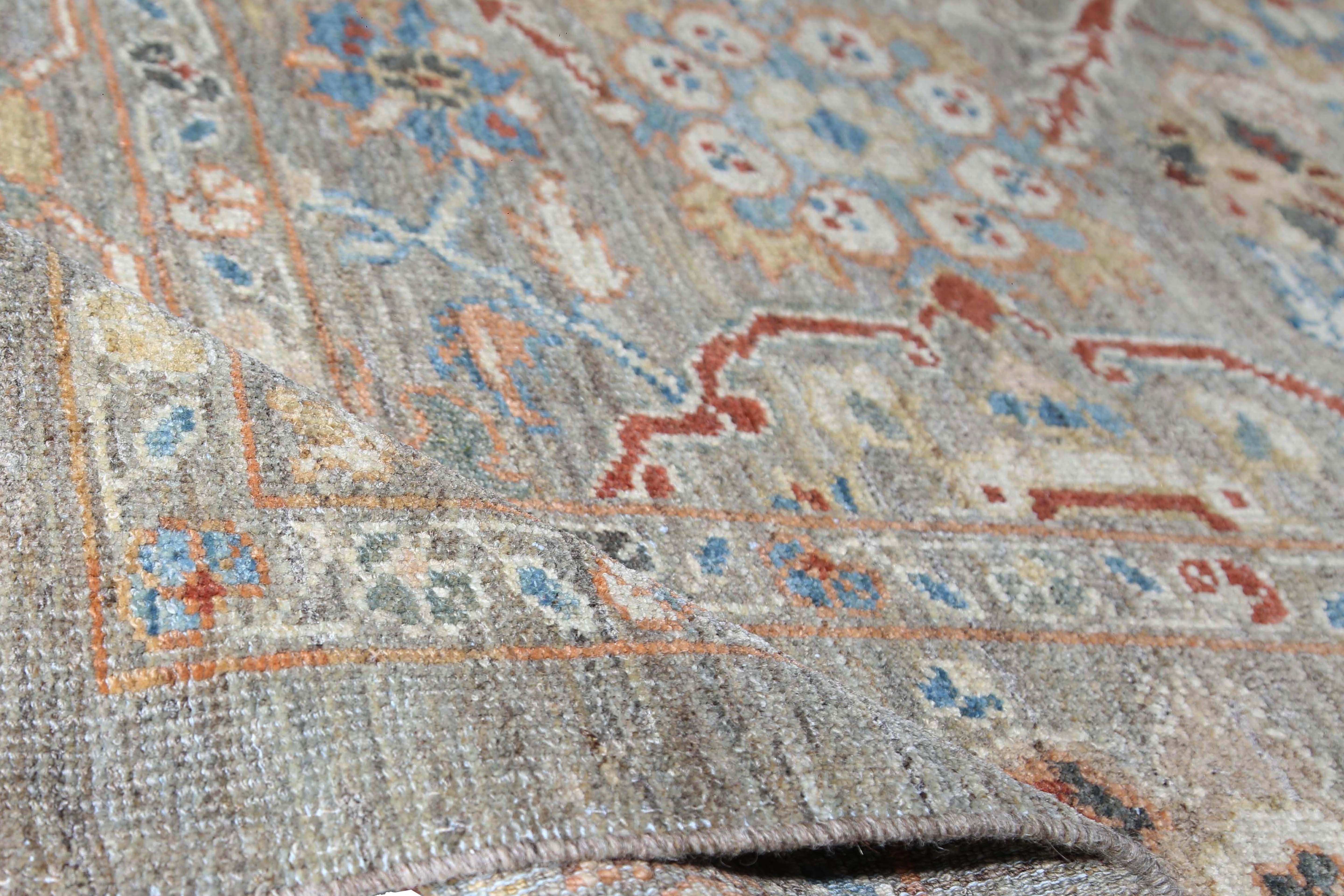 Introducing our exquisite handmade Sultanabad rug from Turkey, measuring 9'5'' by 12'8''. This traditional style rug features a stunning mix of light grey and brown in the background, with pops of rusty red, light blue, orange, and yellow in the