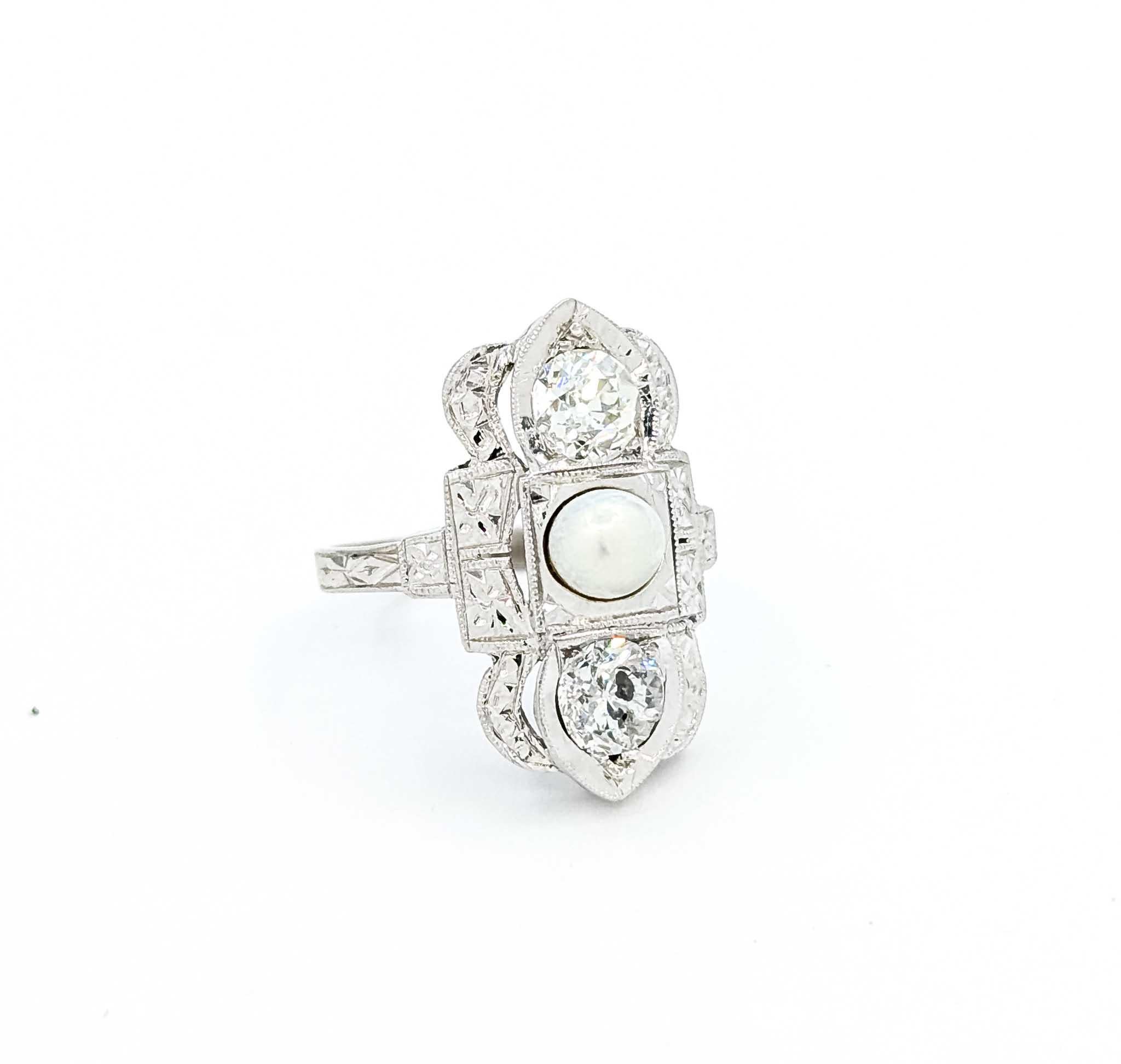 Exquisite Diamond and Akoya Pearl Ring in 18k White Gold

Introducing this exquisite ring crafted in 18k white gold, capturing the elegance of the Art Deco era. This captivating piece showcases a central Akoya pearl, measuring 4.7mm, surrounded by a