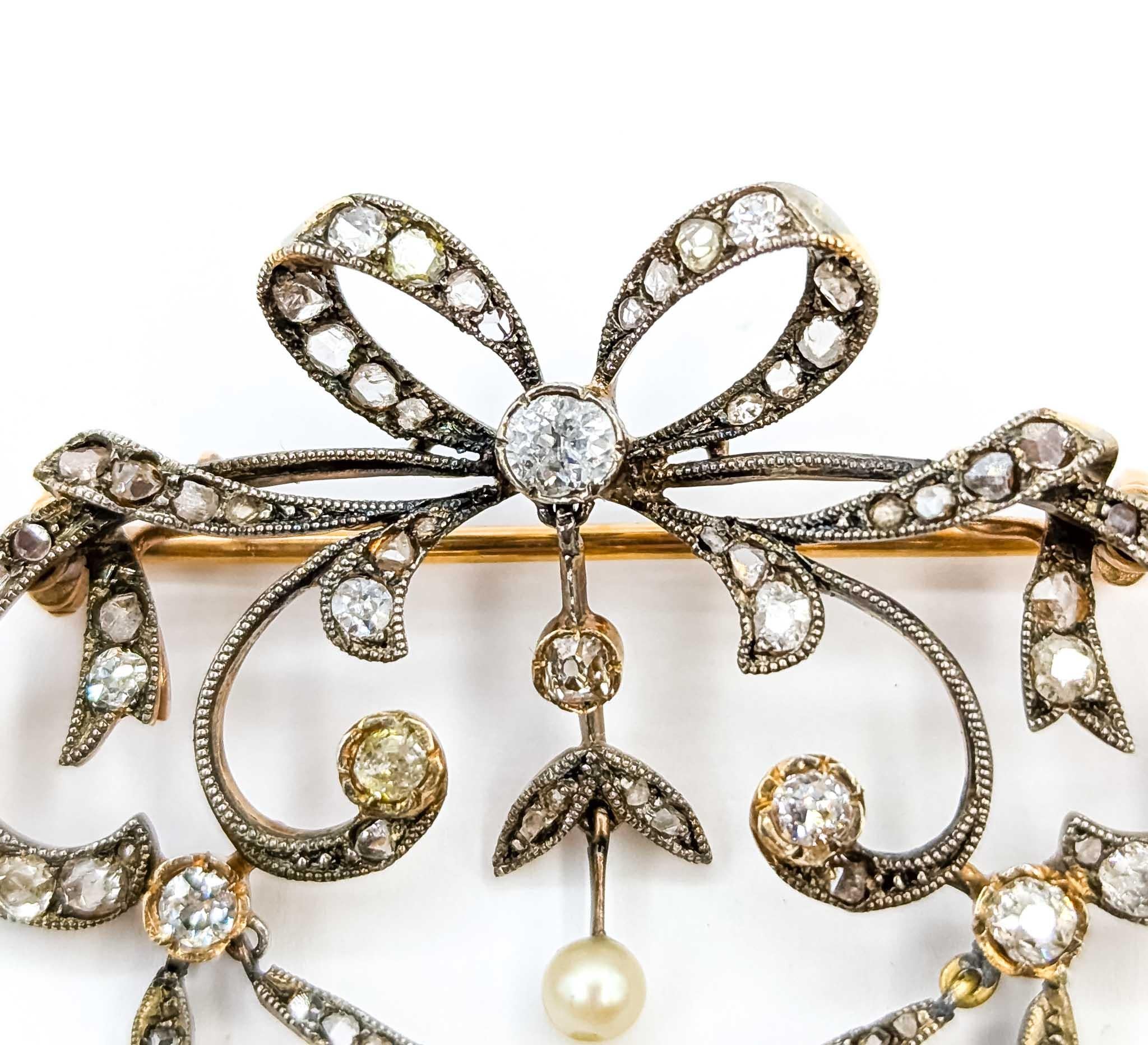 Exquisite Diamond Antique Bow Brooch/Pendant in Sterling Silver and 18k Yellow Gold

Introducing this exquisite Antique Bow Brooch/Pendant, crafted with sophistication in sterling silver and 18k yellow gold. This elegant piece features a stunning
