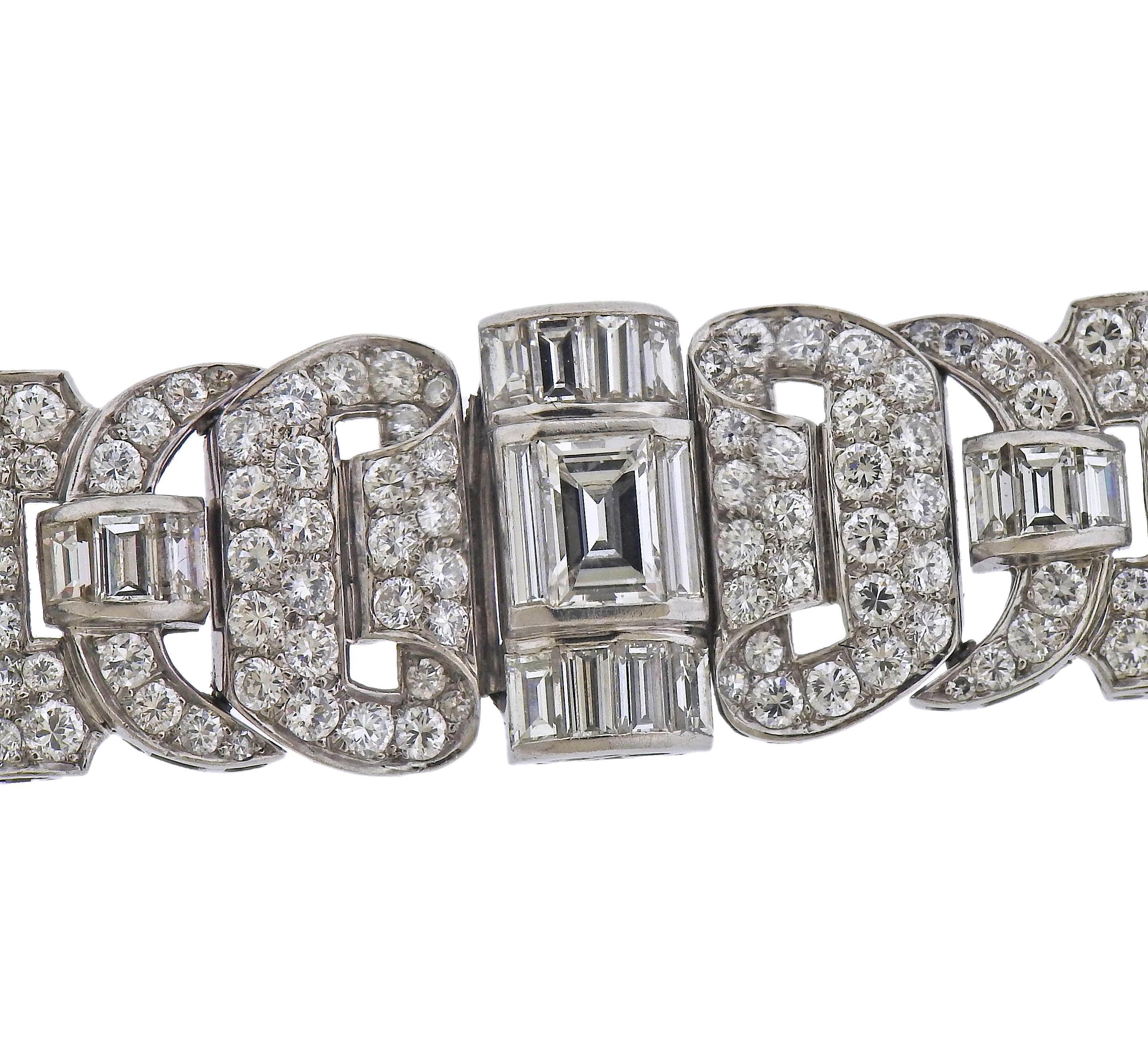 Exquisite platinum bracelet, with oval and round blue sapphires, and a total of approx. 9 carats in round and baguette cut diamonds, with center approx. 0.95ct emerald cut.  Bracelet is 7 2/8