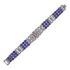 Bracelet exquis en platine avec diamants et saphirs bleus