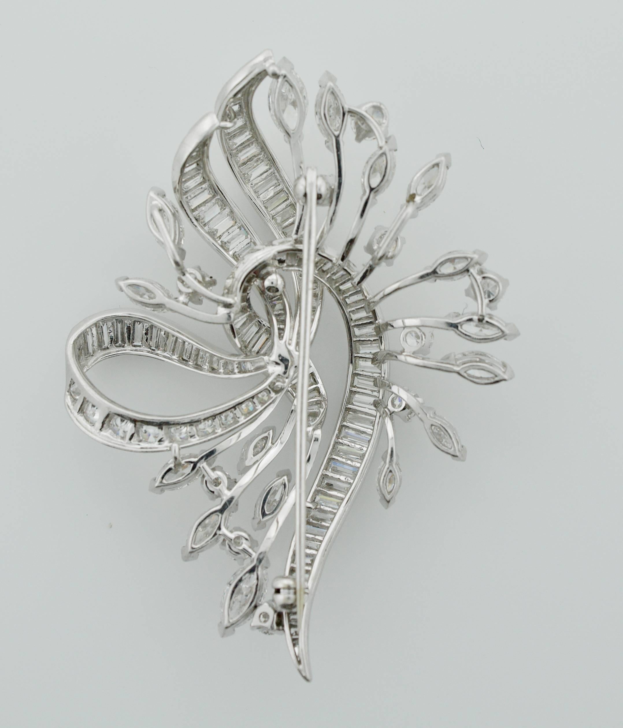 Exquisite Diamond Platinum Brooch Circa 1940's
One Hundred and Twenty Three Round Brilliant, Marquise and Baguette Cut Diamonds weighing 8.00 carats approximately.
Very Fine Quality   GH VVS-VS
