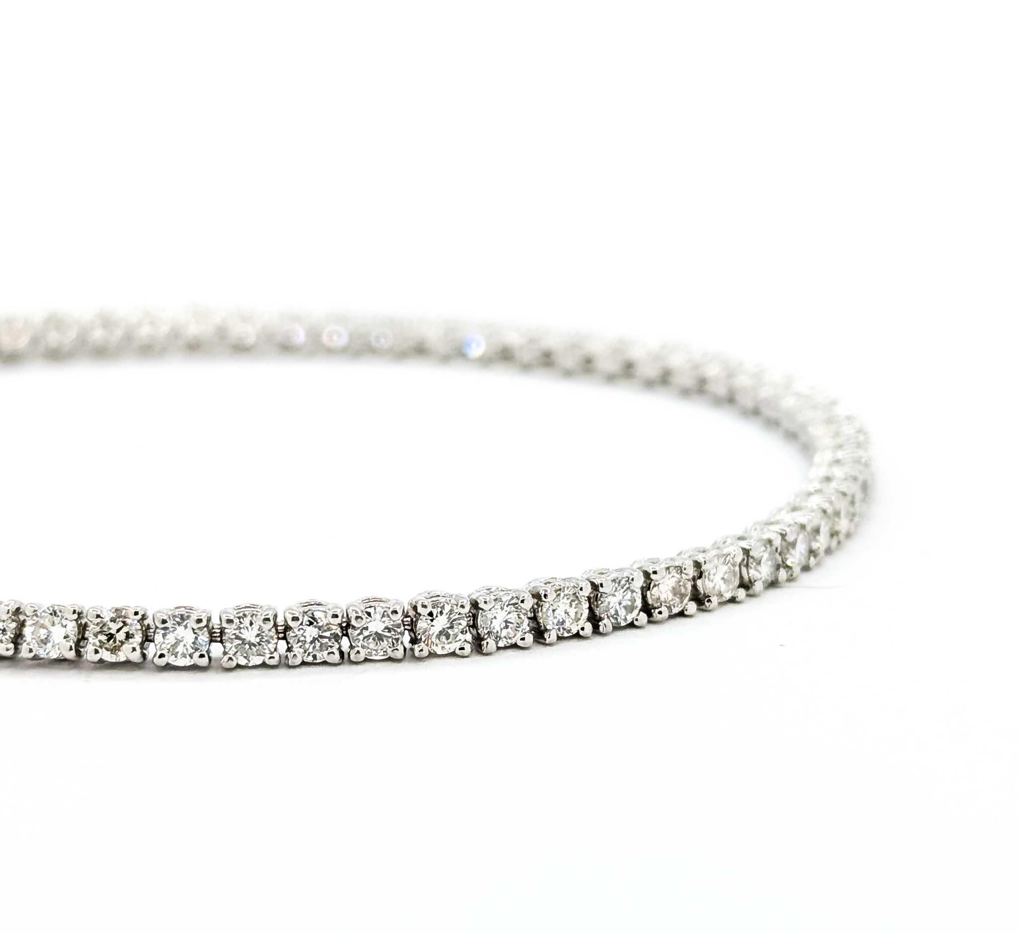 Exquisite Diamond Tennis Bracelet in 14K White Gold

Introducing an exquisite diamond tennis bracelet crafted in 14K white gold. This stunning piece showcases a harmonious blend of elegance and timeless design, featuring a continuous line of