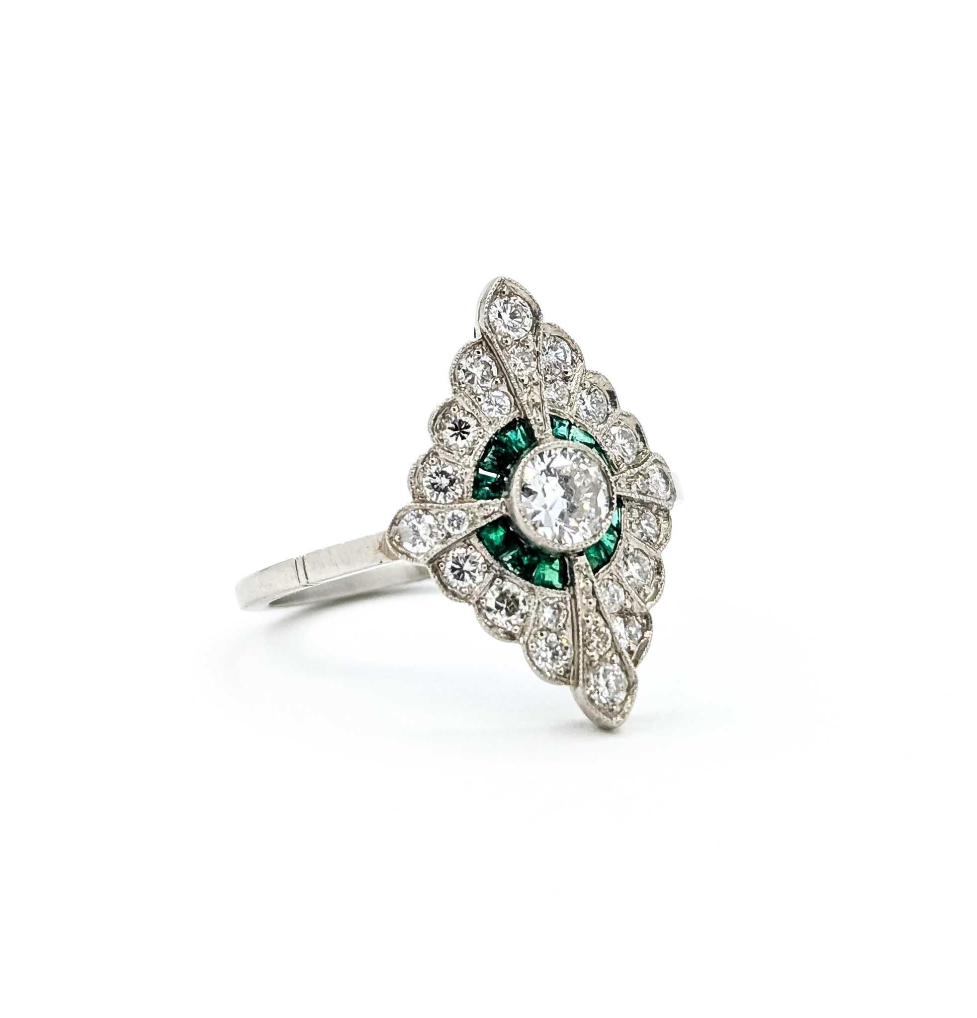 Exquisite Emerald and Diamond Platinum Ring

Introducing this exquisite vintage ring crafted in luxurious platinum, a true testament to timeless elegance. This captivating piece features a stunning array of gemstones, including .25 carat weight of