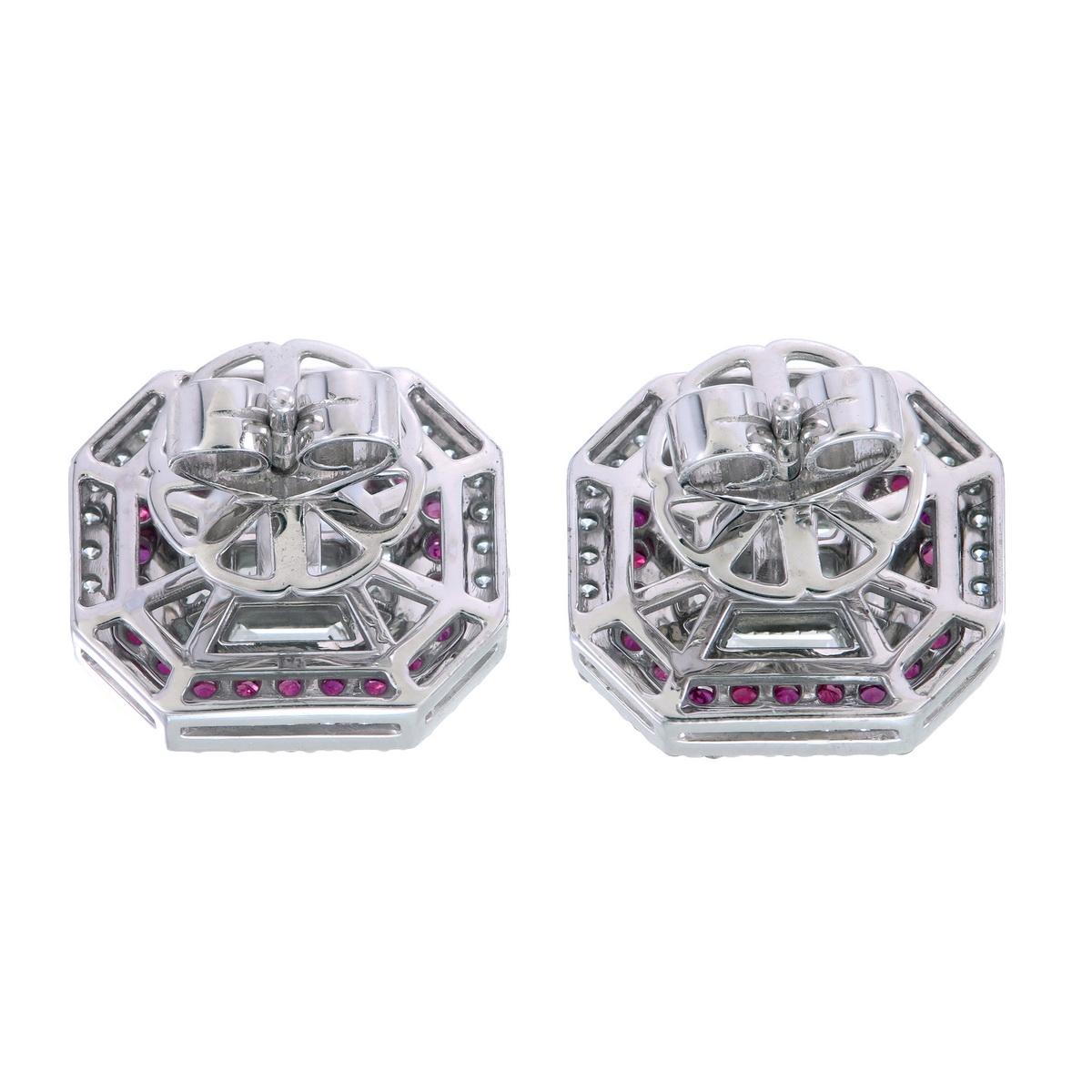 Exquisite Emerald-Cut Diamond & Ruby Halo Stud Earrings in 18K Gold

Indulge in the ultimate expression of luxury with these breathtaking emerald-cut shaped diamond using fancy shaped diamonds in invisible setting and ruby halo stud earrings,