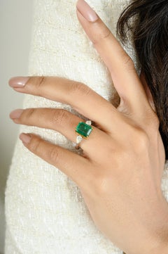 Exquisite Emerald Diamond Three Stone Engagement Ring Studded in 18k Solid Gold