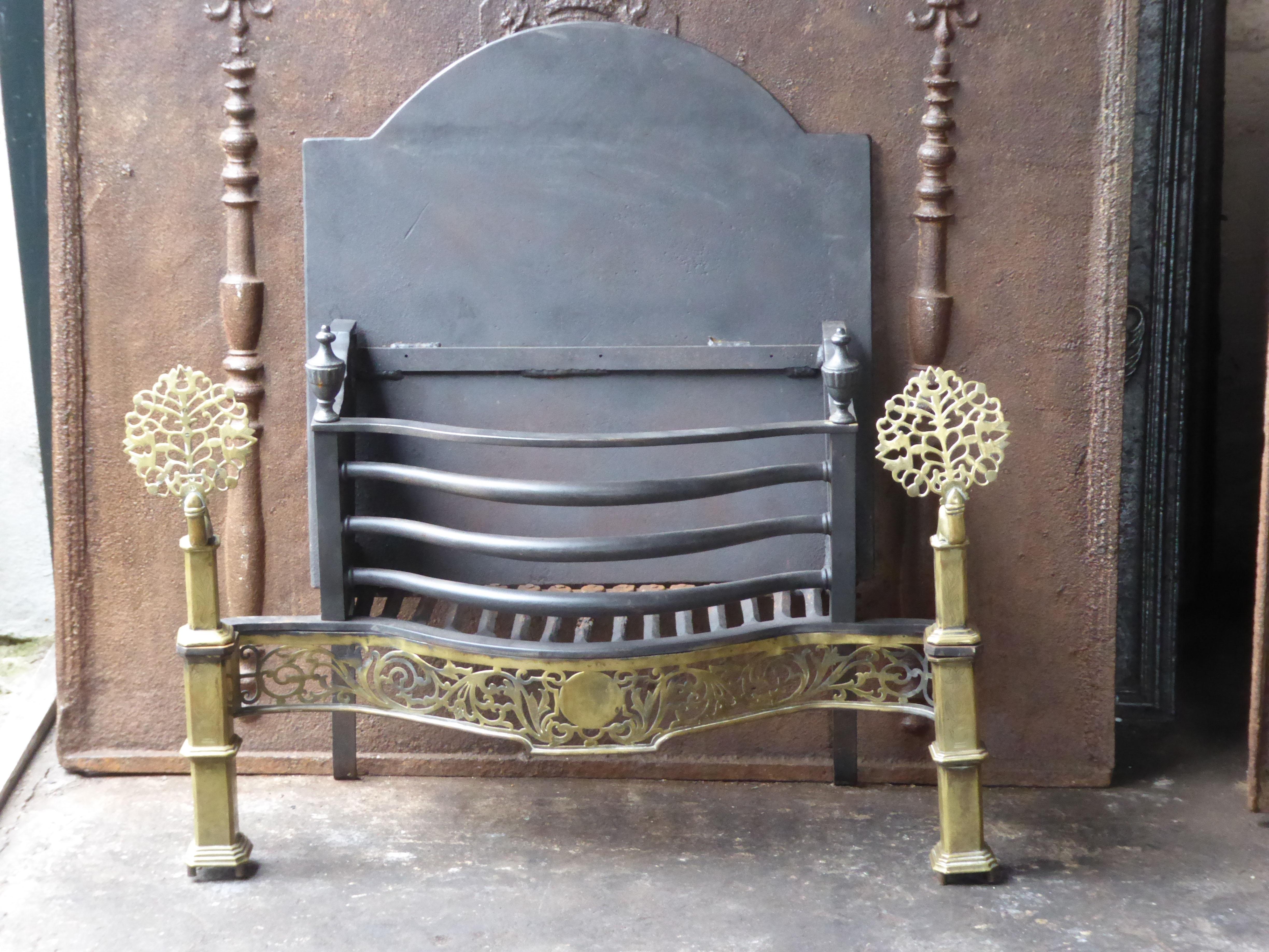 English Art Nouveau fireplace grate made of cast iron, wrought iron and polished brass. The total width of the front of the fireplace grate is 35 inch (89 cm).

This product has to be shipped as freight due to its size and/or (volumetric) weight.