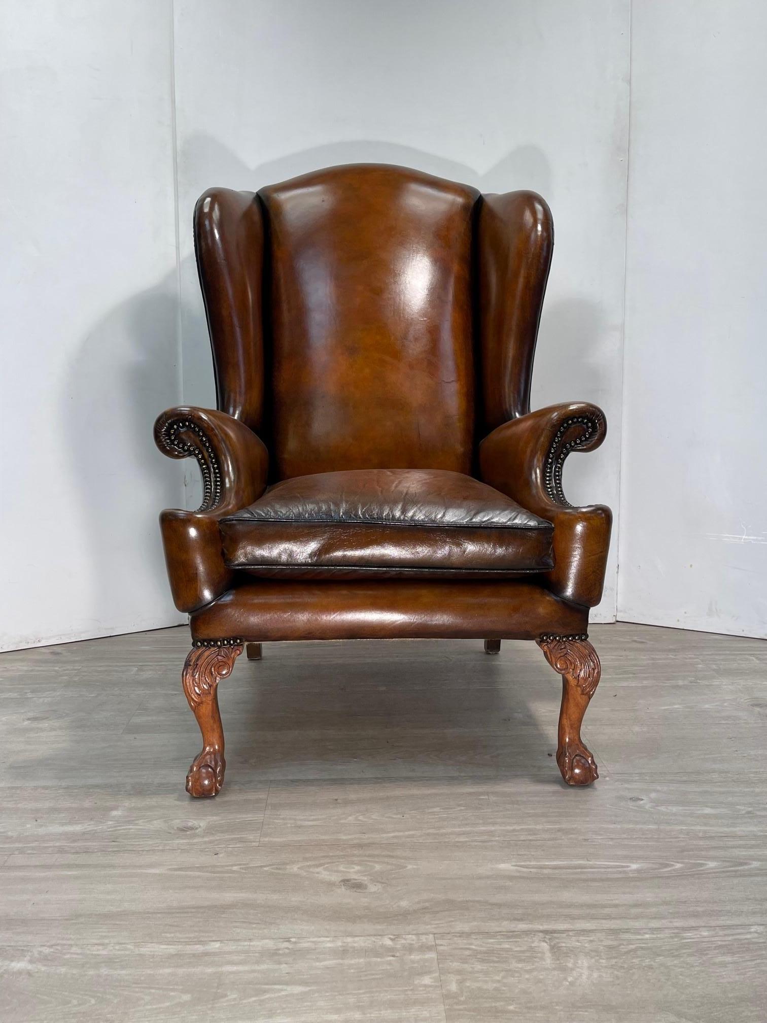 We are delighted to offer for sale this absolutely stunning fully restored hand dyed cigar brown leather, Victorian style oversized wingback armchair with hand carved claw & ball feet.

What a chair! This is pure art furniture from all angles, the
