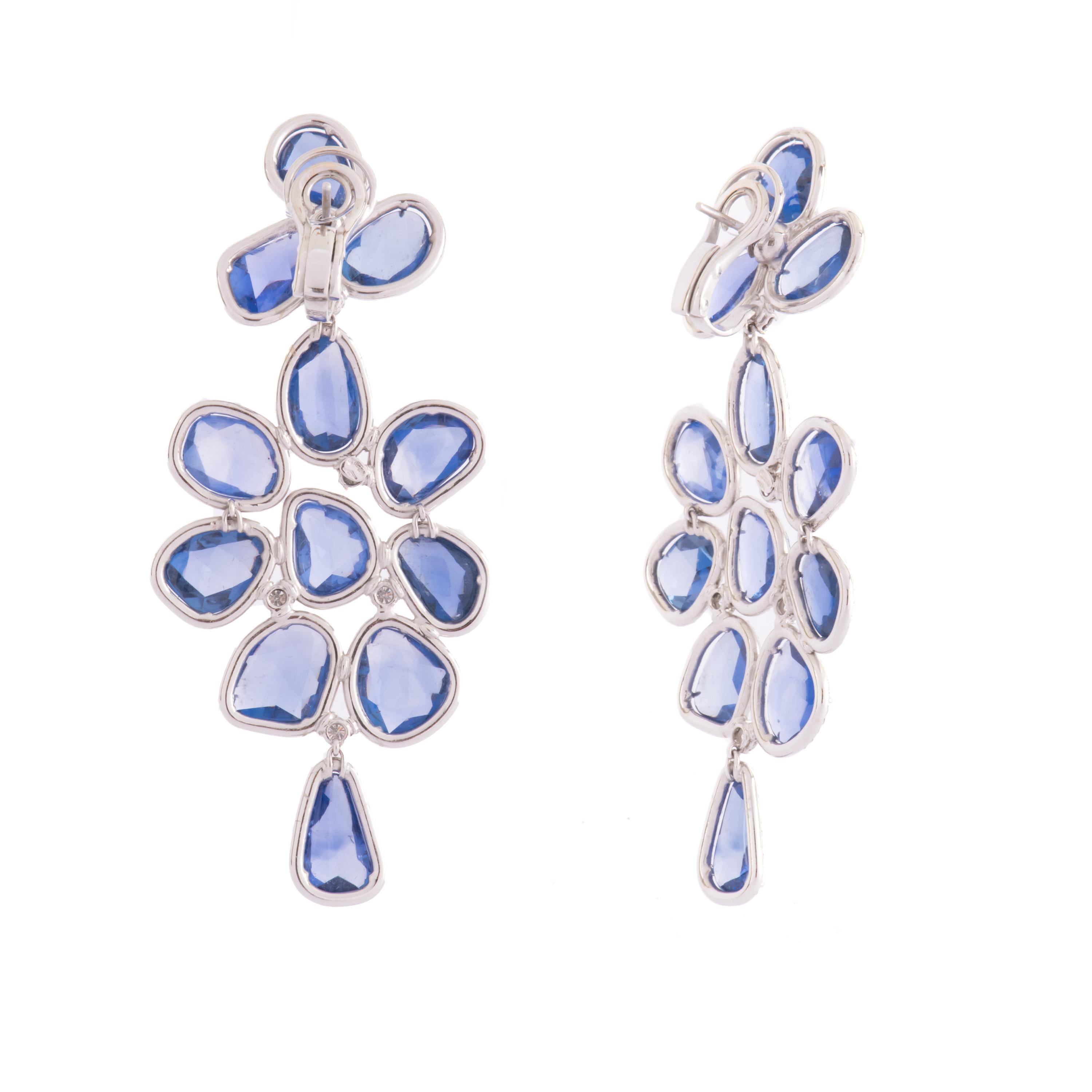 A gorgeous pair ofwhite gold chandelier earrings featuring blu sapphires flat cut ct. 50 and diamonds ct.4.39
Created by Enrico Trizio