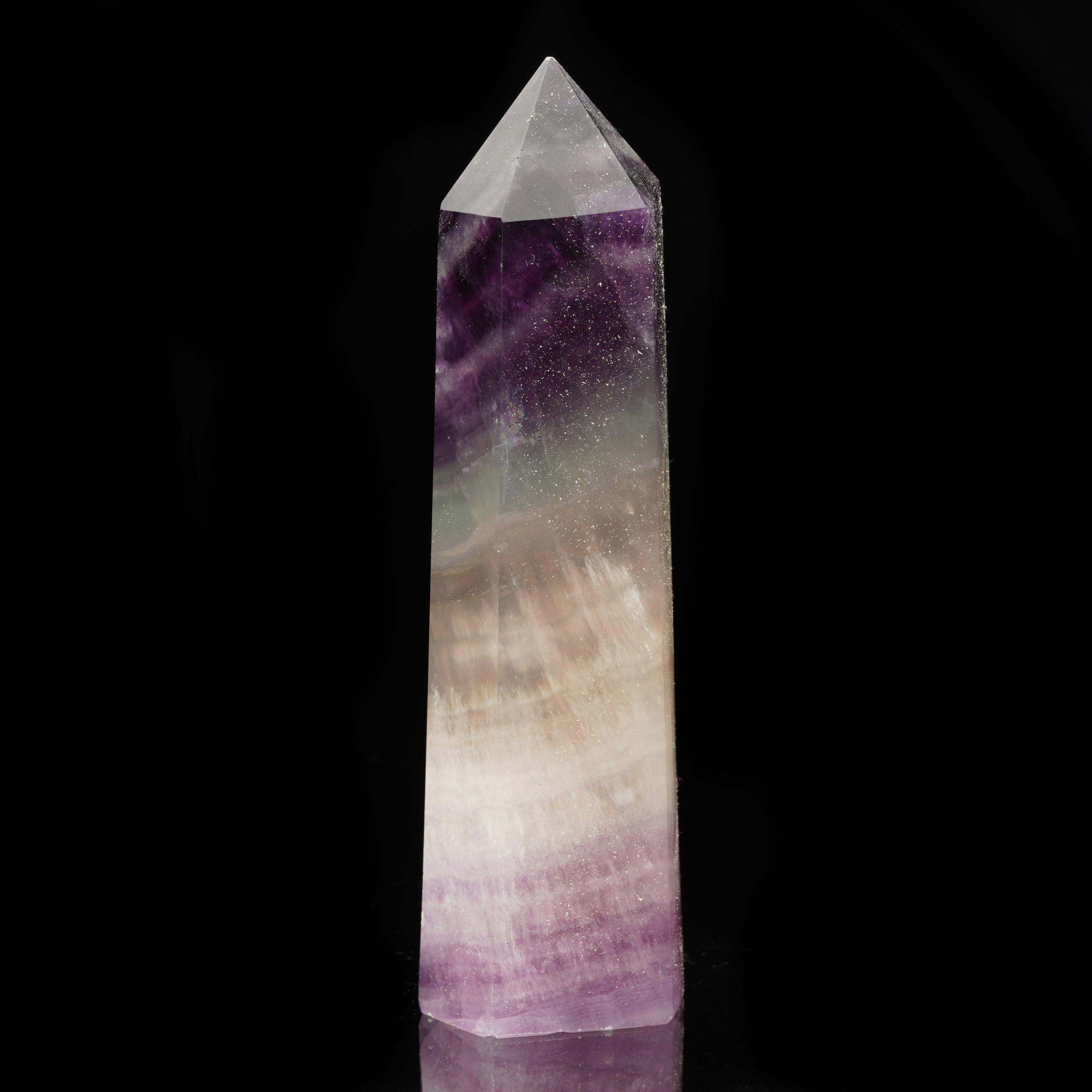 This stunning Fluorite obelisk hails from China, a region renowned for producing vibrant and high-quality mineral specimens. Fluorite is celebrated for its mesmerizing range of colors and ability to fluoresce under ultraviolet light. This particular