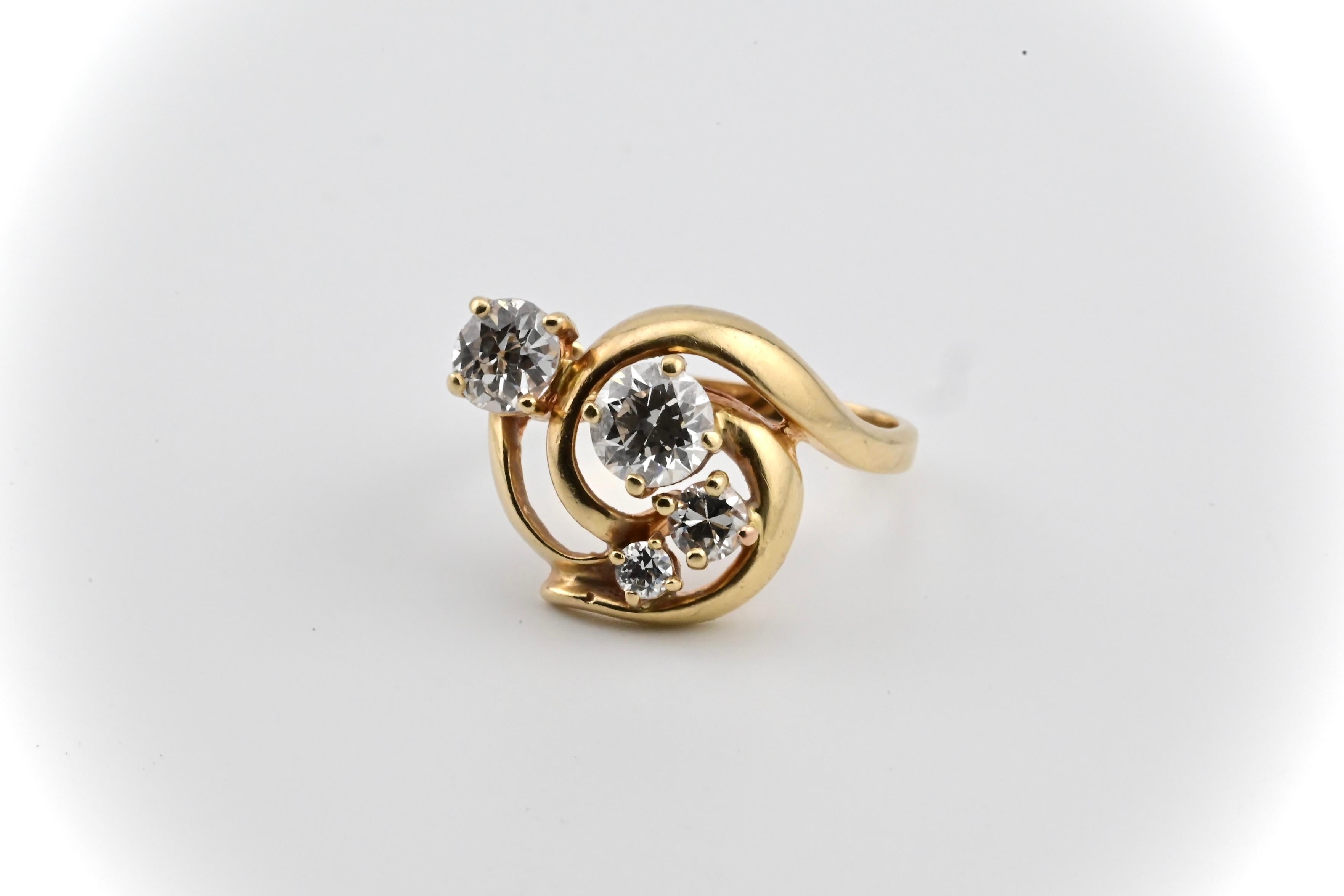This is a gorgeous, yet elegant free from styled gold & diamond ring. The three diamond stones in the middle compliment each other with a big to small stone size gradient, with a single stone complementing the trio on the left. Quality is VS and