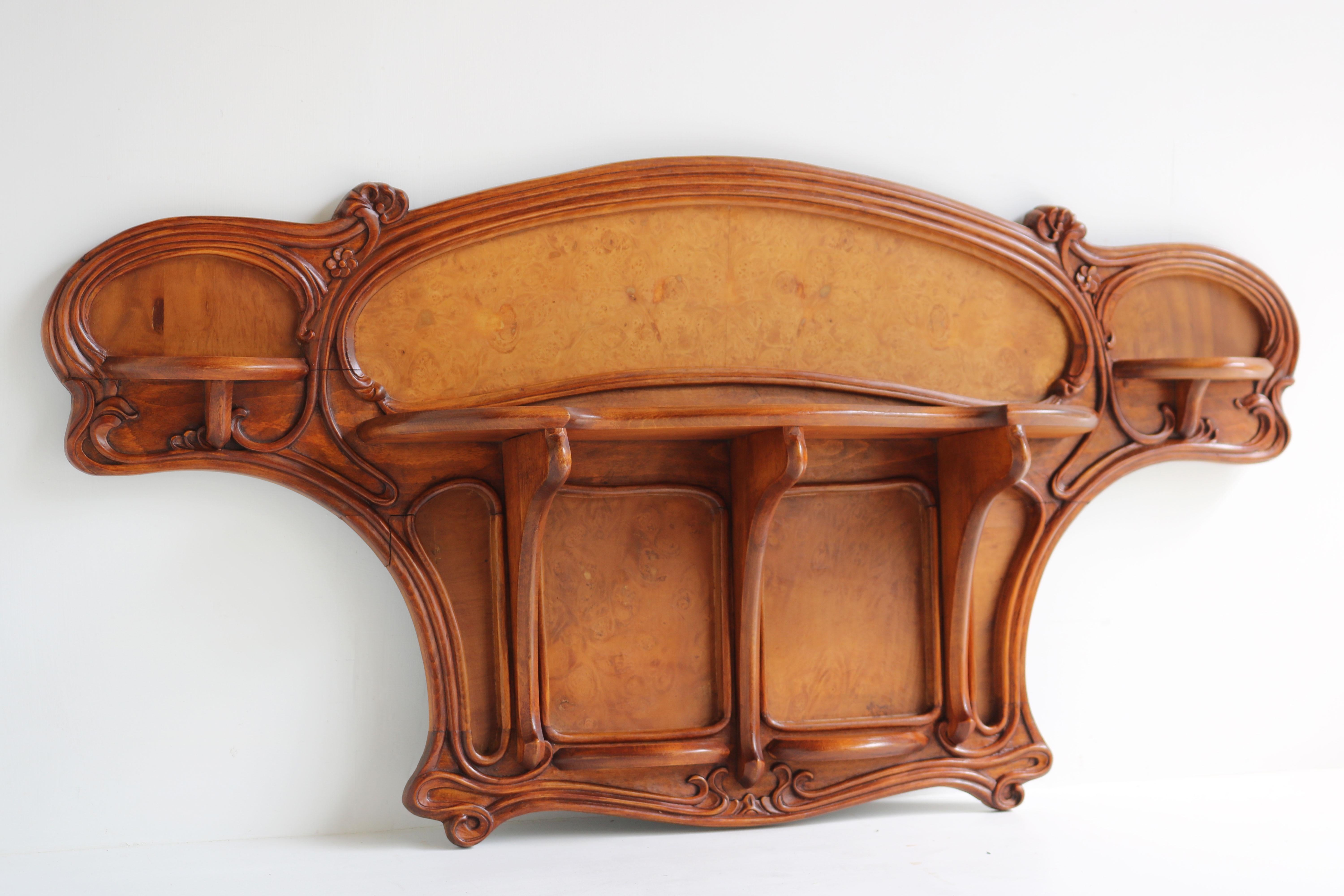Exquisite & most rare! This French Art Nouveau wall shelf designed by art nouveau grandmaster Eugene Gaillard circa 1900. 
Superb organic design with floral carved decorations , made from solid walnut hand-carved and decorated with lemon wood