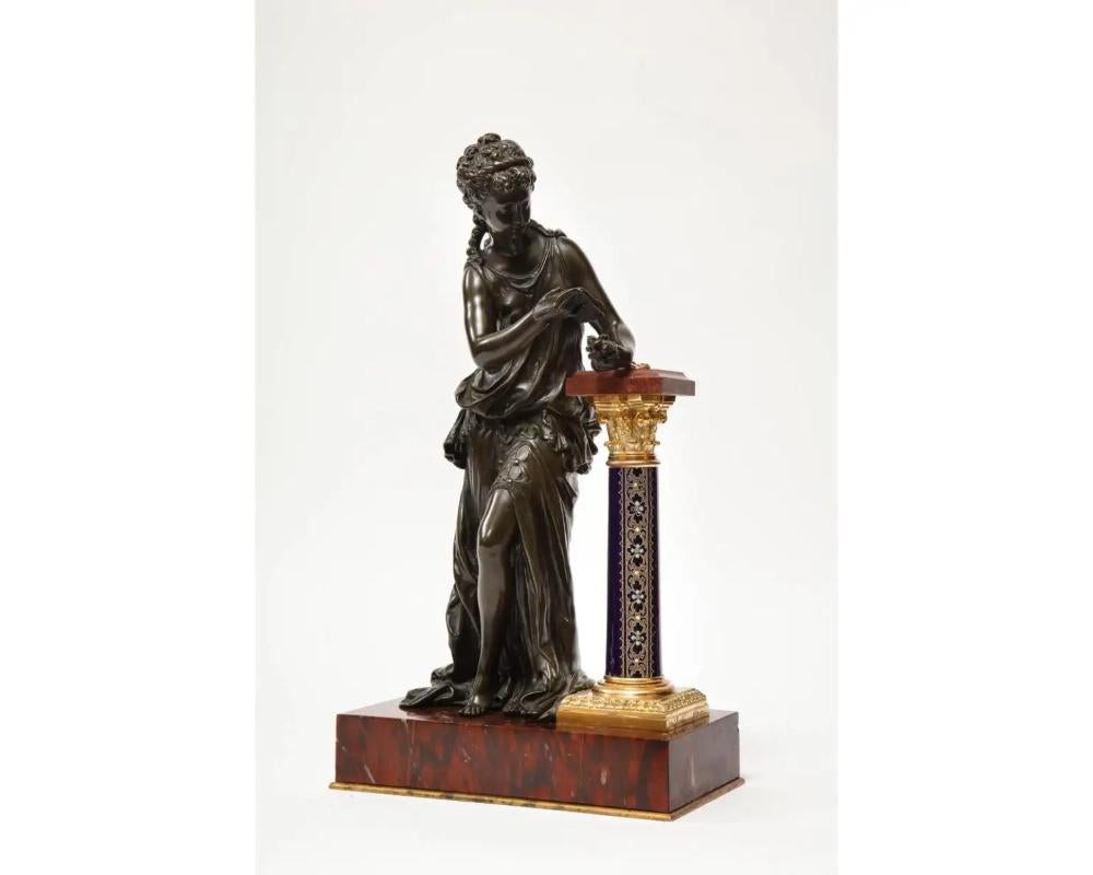 An exquisite French gilt and patinated bronze sculpture of venus, resting on a Sèvres style cobalt blue enameled porcelain pedestal, on rouge marble base, by Mathurin Moreau, circa 1880.

This sculpture is not an ordinary one. It's very rare,