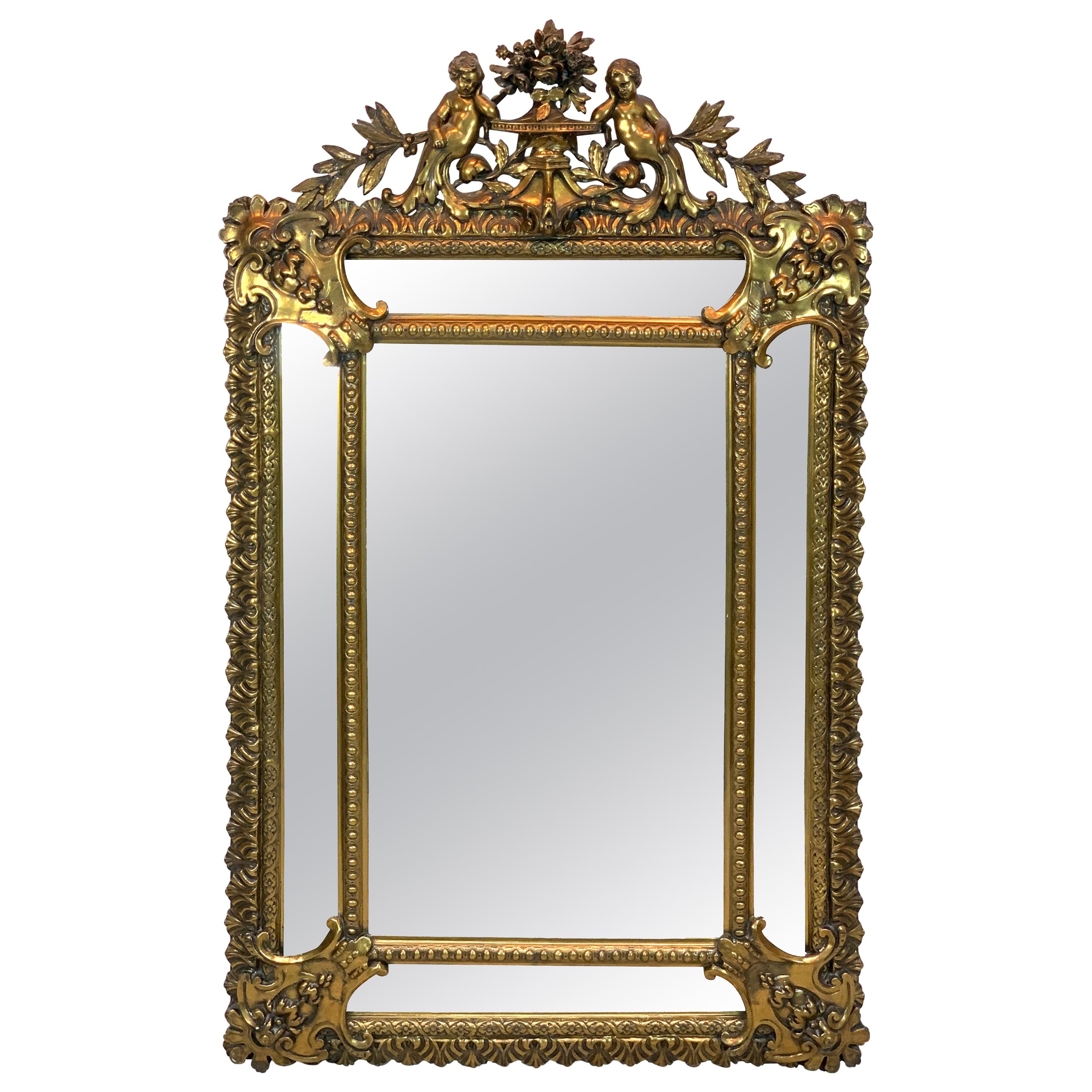 Exquisite French Carved Giltwood Putti Motif Cushioned Mirror, Paris, 1900