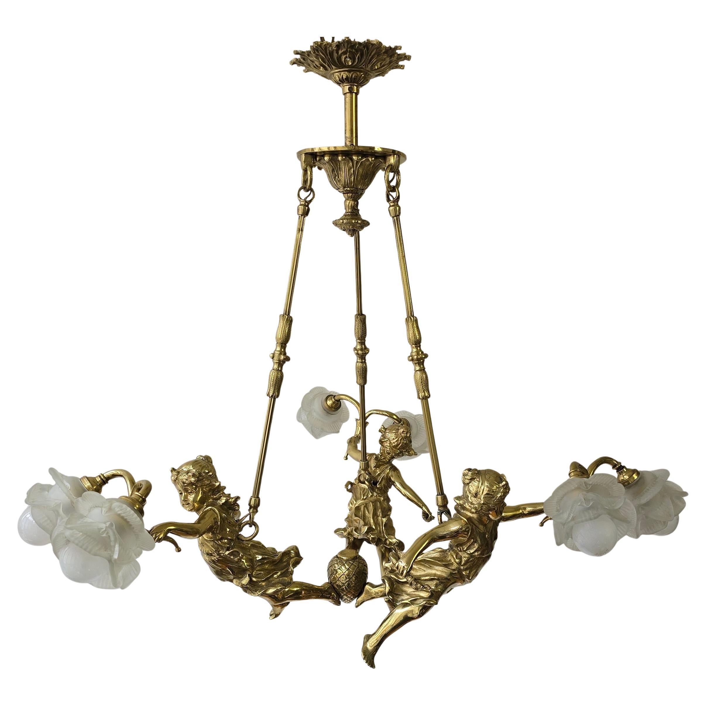 Exquisite French Gilt Bronze Chandelier with Cherubs and Frosted Glass Floral Shades, circa 1900

An exceptionally rare and charming French gilt bronze chandelier, dating from the late 19th to early 20th century (circa 1880–1920), designed in the
