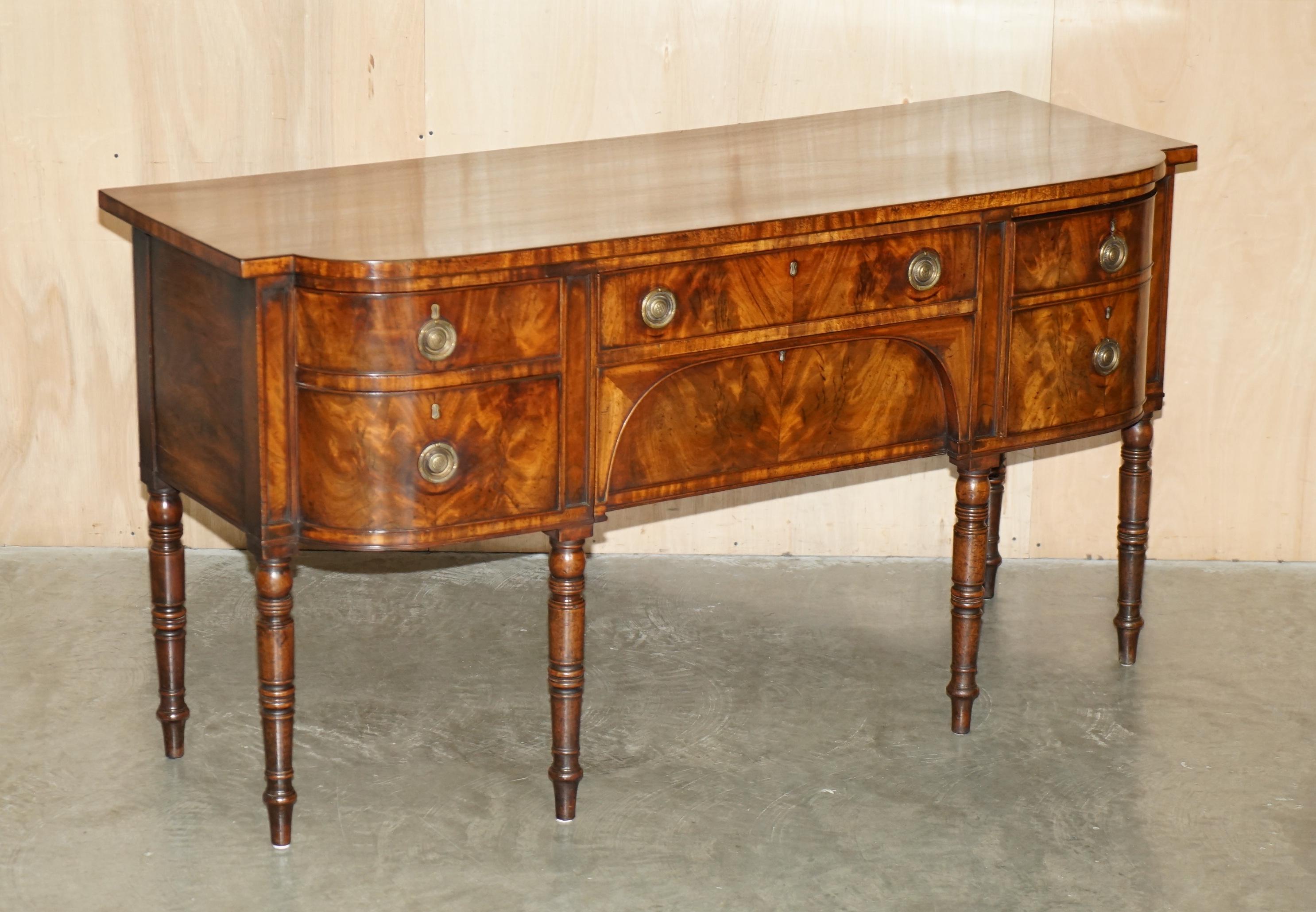 Royal House Antiques is delighted to offer for sale this absolutely sublime King George III circa 1780 English flamed mahogany sideboard that has been fully restored 

Please note the delivery fee listed is just a guide, it covers within the M25