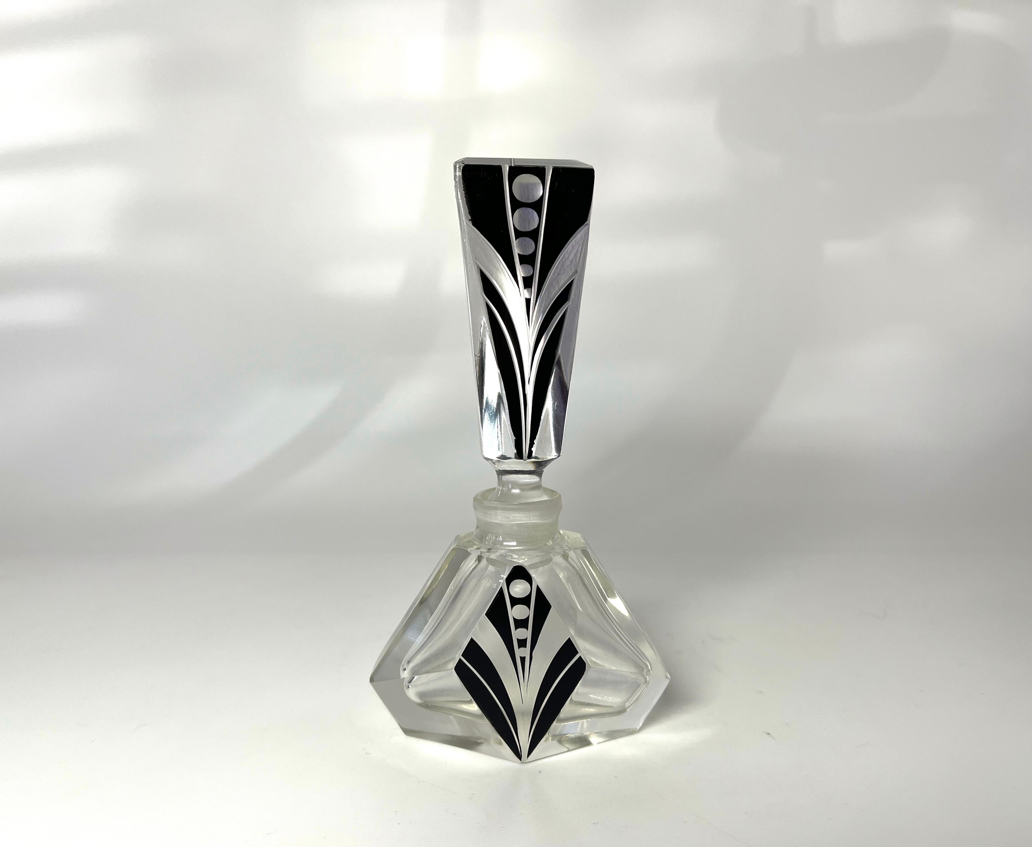 Recognisably first class, beautiful Czech crystal Art Deco perfume bottle
Clean geometric pattern on black enamel. 
Vintage Bohemian, Czech crystal 
Circa 1930's
Height 4.75 inch, Width 2.5 inch, Depth 1.5 inch 
Exceptionally good condition.