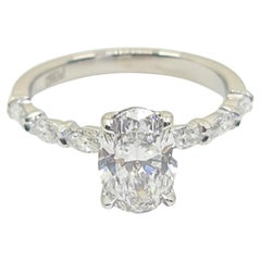 Exquisite GIA Certified 1.20 Carat Oval Diamond Ring with 0.3 Carat Marquise