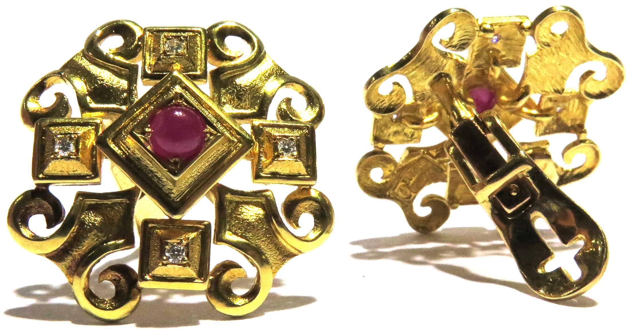Theses gorgeous Ilias Lalaounis 18k earrings, besides being easy to wear if your ears are not pierced, can easily have a post added to make them pierced. The cabochon cut ruby centers exude a beautiful red color. These earrings are flattering on all