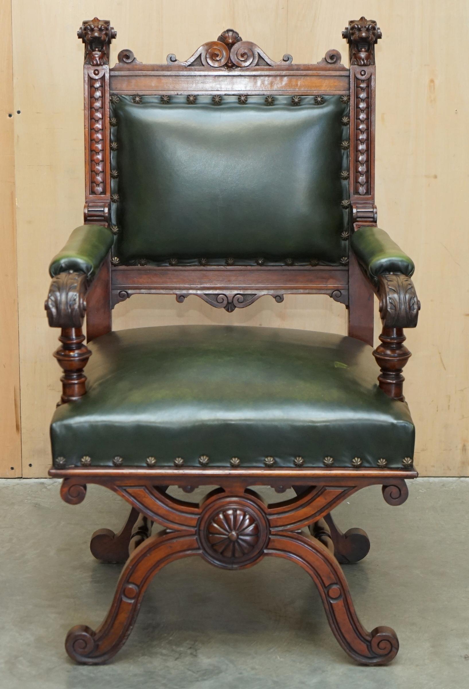 delighted to offer for sale this stunning original hand made in England circa 1860-1880 Throne armchair with hand carved Lions Head finials and green leather upholstery 

Please note the delivery fee listed is just a guide, it covers within the M25