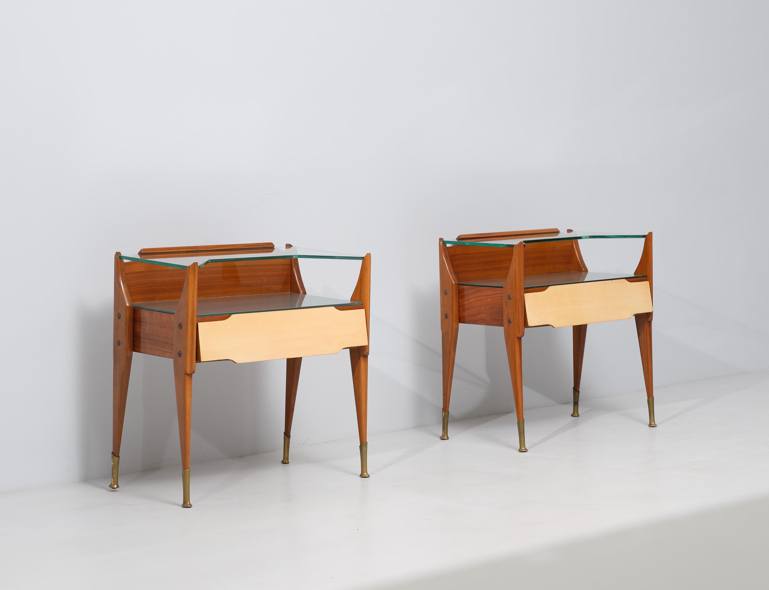Indulge in the meticulous artistry of 1950s Italian craftsmanship with this remarkable pair of vintage bedside tables. 

These exquisite pieces showcase the mastery of Italian woodworking, exemplifying the attention to detail and precision that