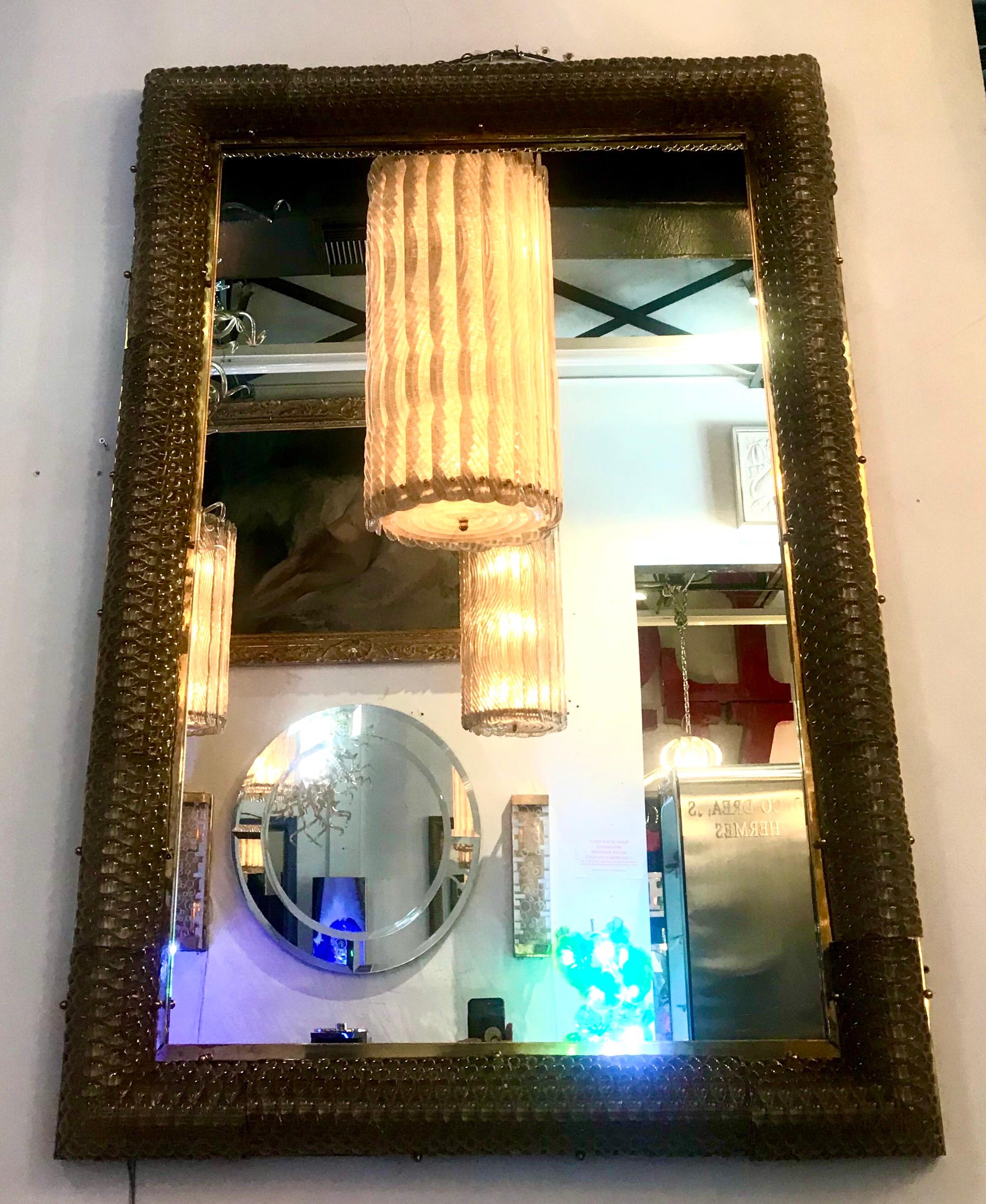 The bronze frame with interlocking smokey bubble hand blown glass pieces, wired within to be illuminated.Beautiful with or without light.