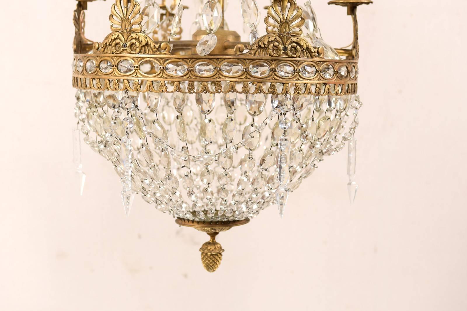 Metal An Exquisite Italian Mid-century Basket-Shaped Crystal and Brass Chandelier For Sale