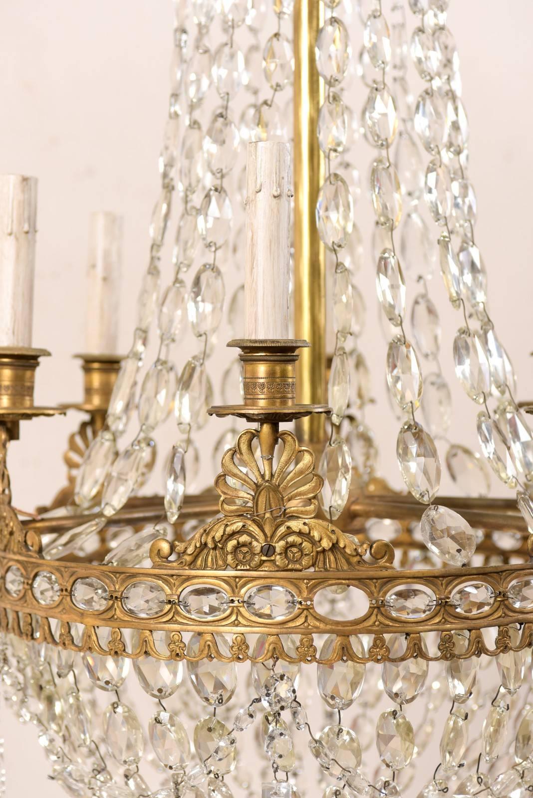 An Exquisite Italian Mid-century Basket-Shaped Crystal and Brass Chandelier For Sale 1