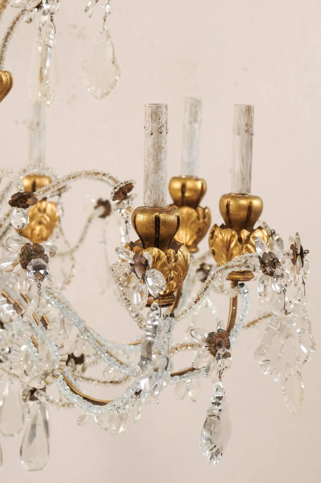 Exquisite Italian Vintage Gilded and Carved Wood Multi-Tiered Crystal Chandelier In Good Condition In Atlanta, GA