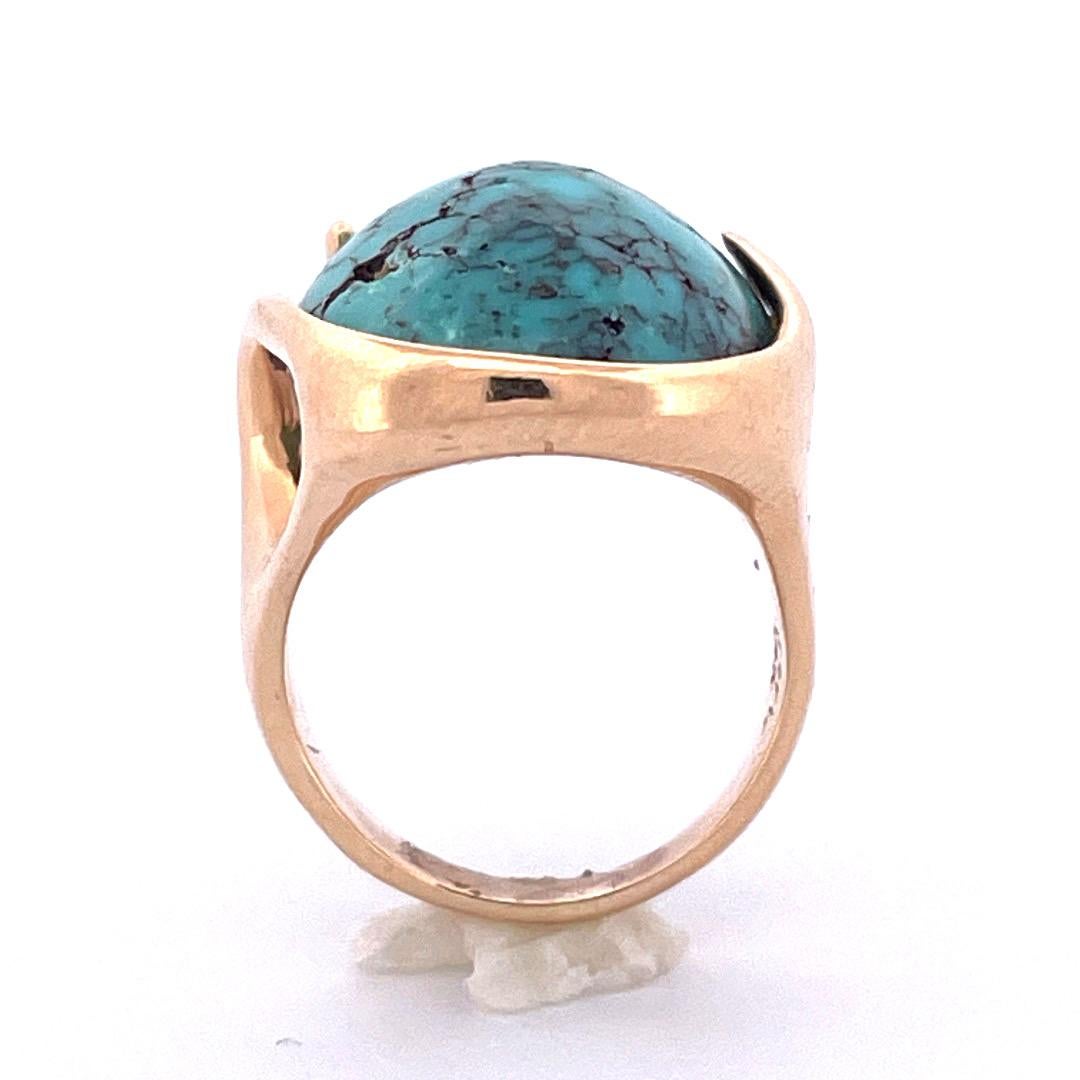 Indulge in the captivating beauty of our 14K yellow gold oval turquoise ring. This exquisite piece showcases a mesmerizing turquoise gemstone with intricate patterns reminiscent of swirling marble.With a weight of 11.8 grams, this ring shows a