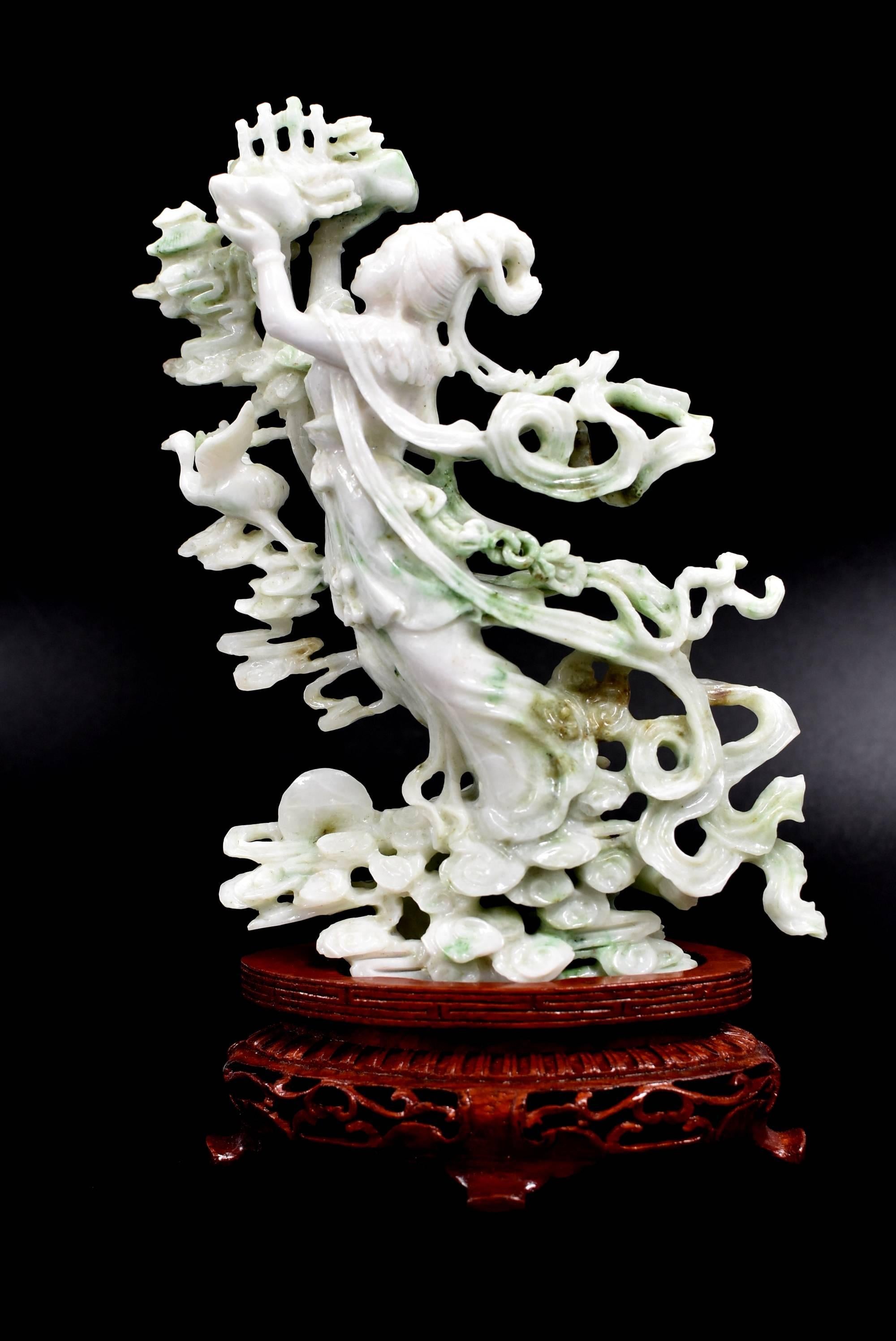 Words cannot describe how fine this wonderful piece is. The material is all natural Jadeite Jade (Lab tested and Certified), with variations of green and lavender on the mainly snow white gemstone. The carving is done by a master jade carver with