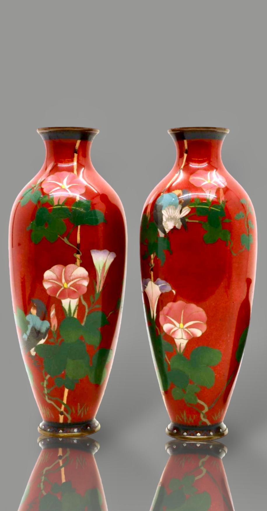 
A Exquisite Japanese Cloisonne Enamel Pair of Vases.


19th C


Meiji Period


Each vase of baluster form, worked in silver wire with an intricate colorful bird perched on branches of lily flowers reserved on an apple red metallic ground .

H-31