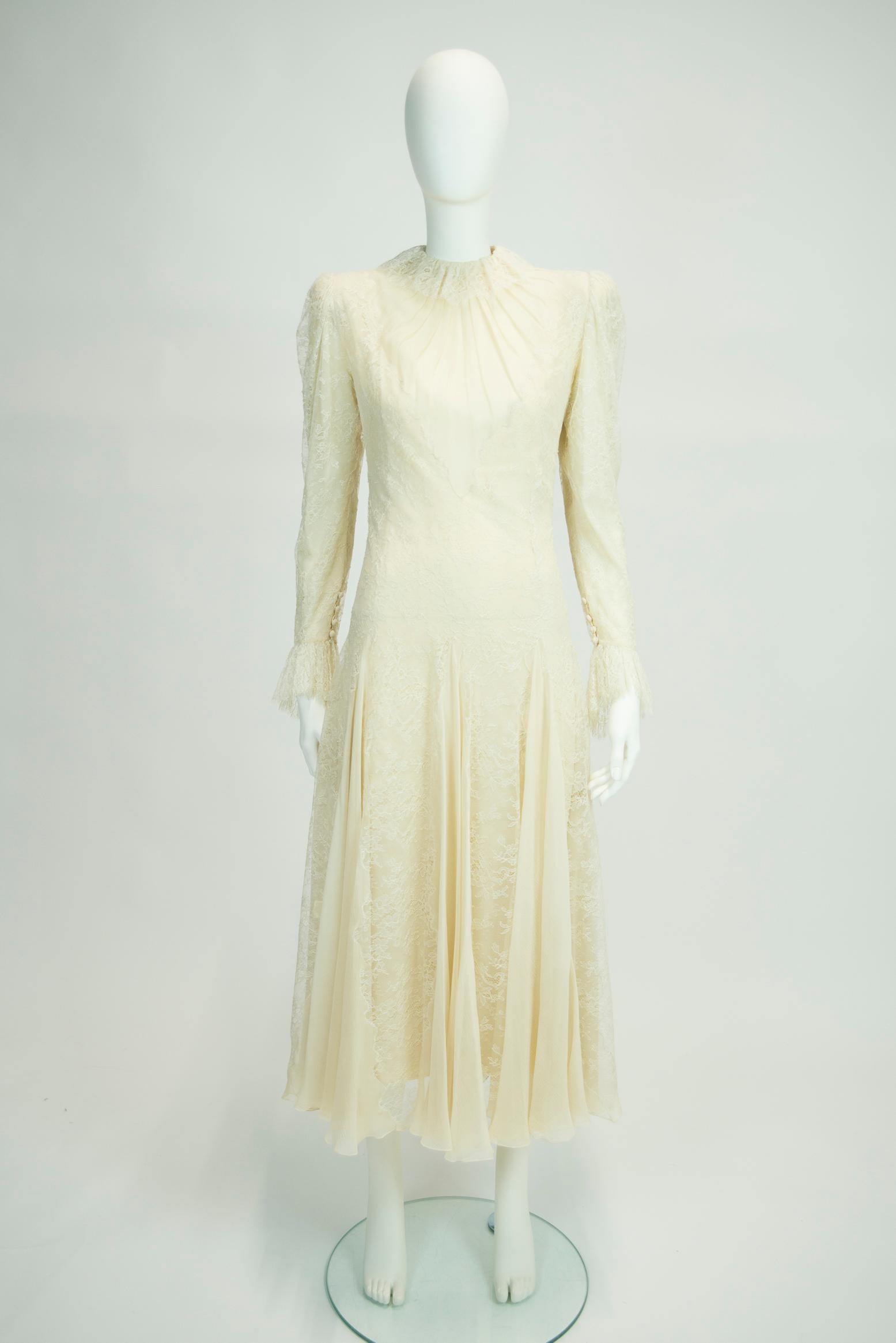 This early 80's Scherrer haute couture dress could be a fabulous option for a bride-to-be. Made from delicate off-white lace which is underpinned with a refined color matching silk-chiffon to reduce the transparency, this dress features fine godet
