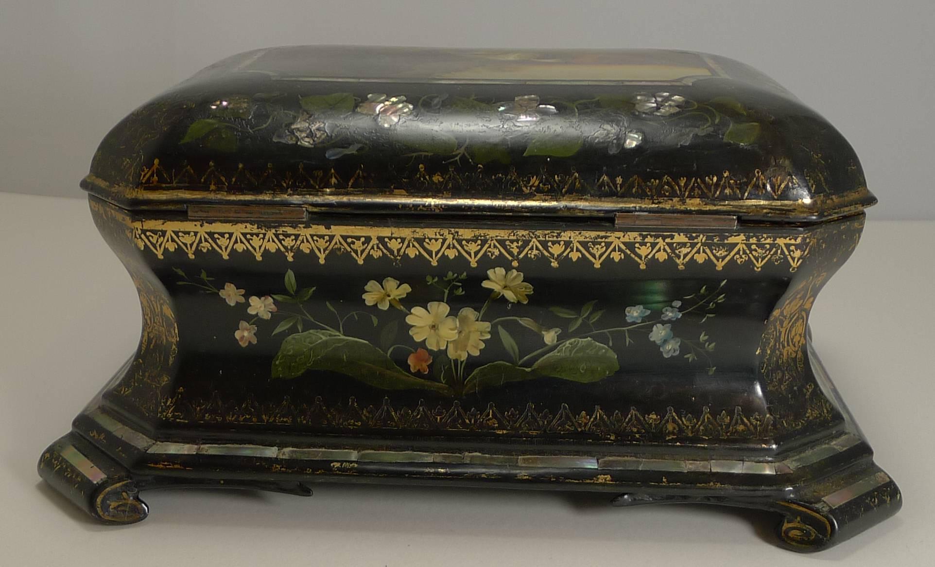 An exquisite and quite charming jewelry box dating to circa 1860 and made from lacquered papier mâché by the most famous of English makers, Jennens and Bettridge, signed on the underside 