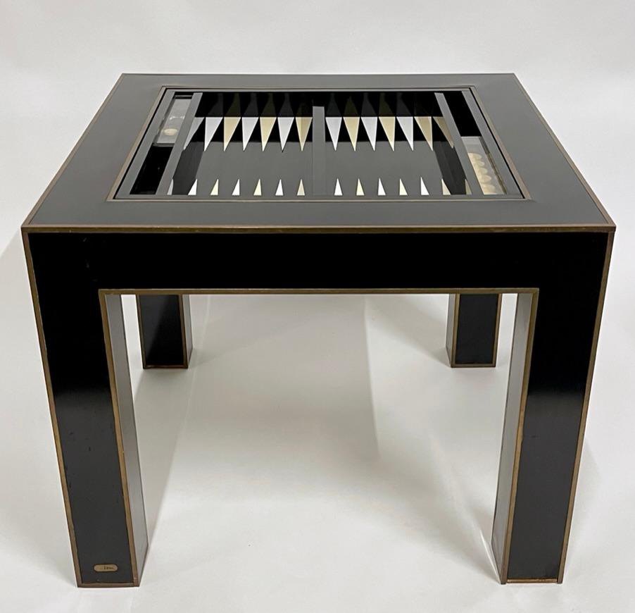 Truly unique flip top backgammon/ game table. The top rotates seamlessly to go from a standard leather top game table to a fully equipped backgammon table. The pieces for the game are contained behind a lucite slide that opens to reveal the