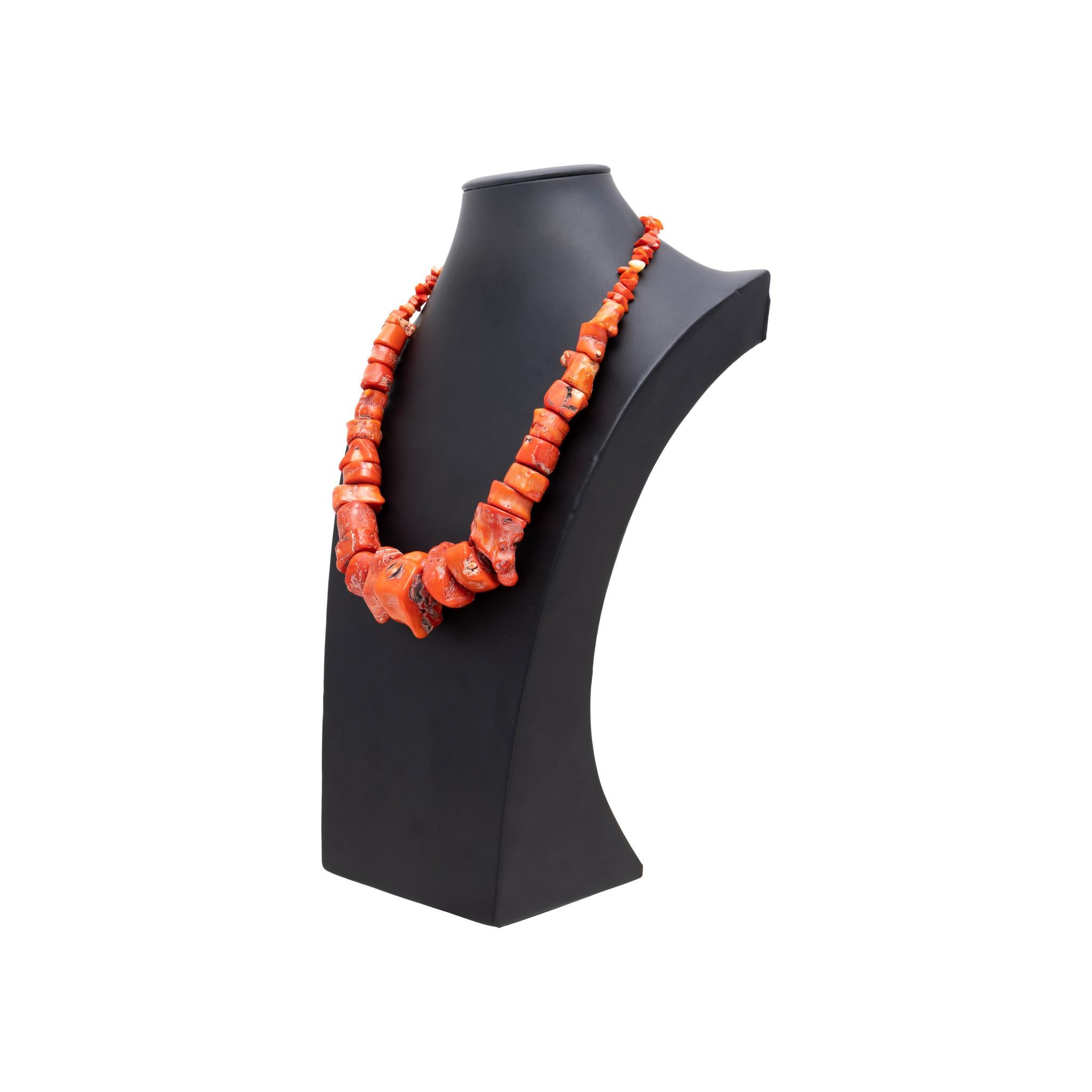 Beaded necklace with exceptionally large gradient size coral beads. Largest stone is over 1 inch across! Coral is natural, with semi-smooth beads that still retain the 