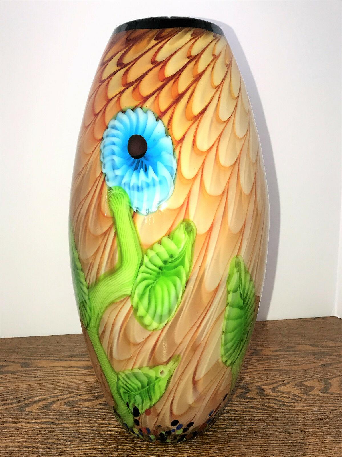 For the lovers of Murano, an alluring Floral design art glass vase. Simply beautiful, multi colors featuring an abstract flower design. Vase measures approx. 15 inches tall x 7 inches wide with a 24